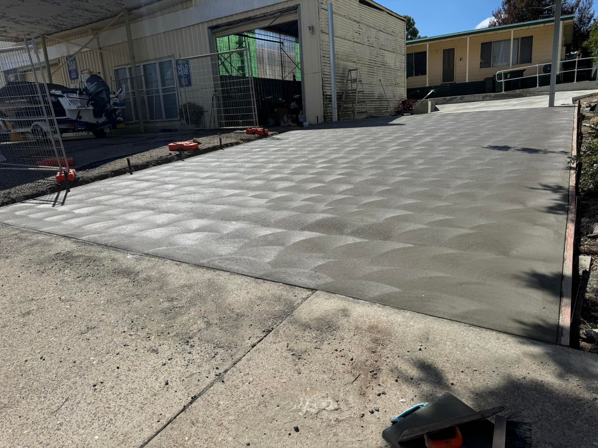A Newly Paved Driveway Leading to a House — Next Level Construction Contractors in Gundagai, NSW