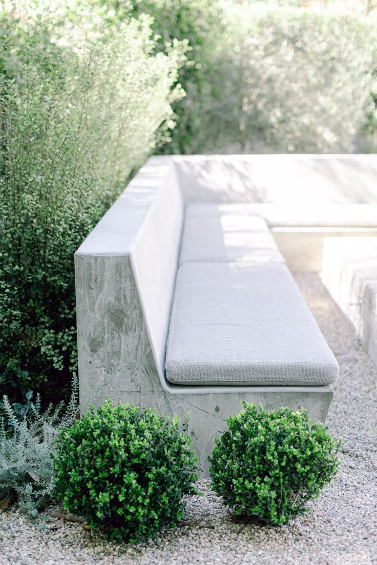A Brick Wall With Pillows and Candles on It in a Garden — Next Level Construction Contractors in Gundagai, NSW
