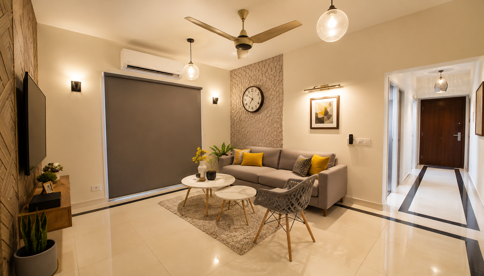 Furnished Apartments in Addis Ababa with a cozy living room, gray sofa, patterned rug, warm lighting, and large balcony.