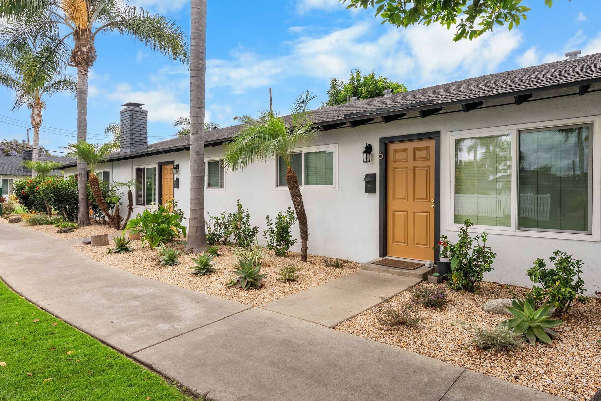 front door to two-bedroom apartment single story building