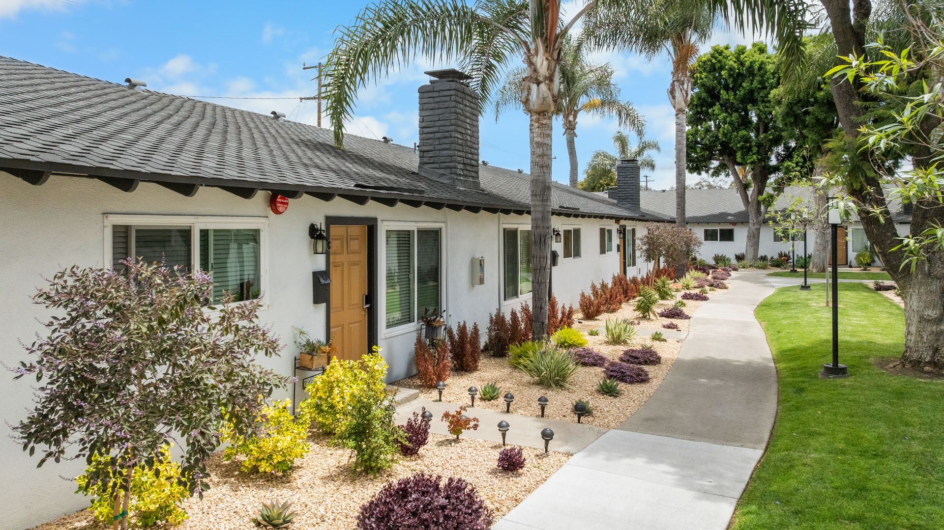 exterior apartment building with eco-friendly desert landscaping