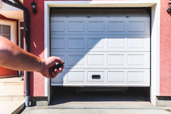 Hand use remote controller for closing and opening garage door