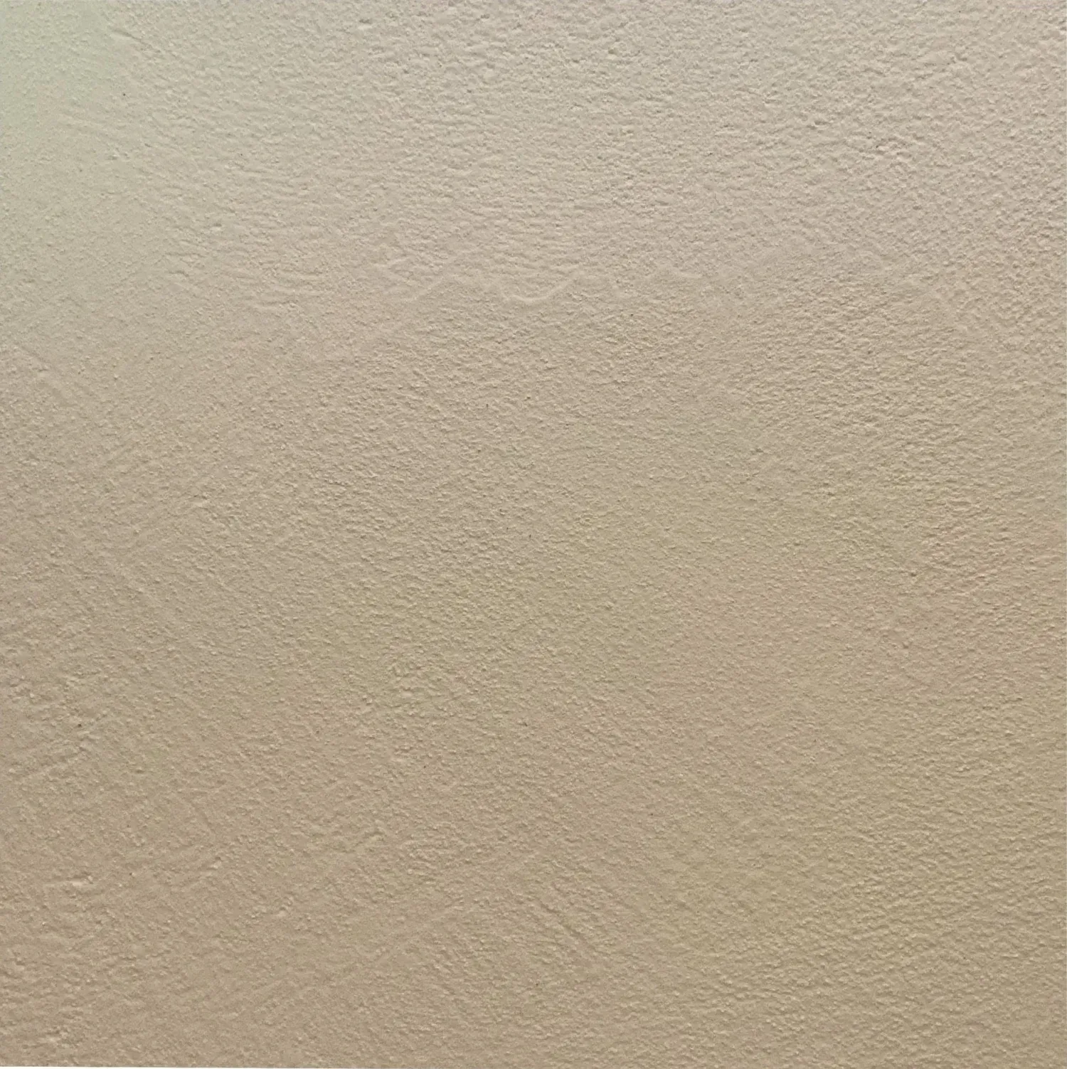 Textured beige wall.