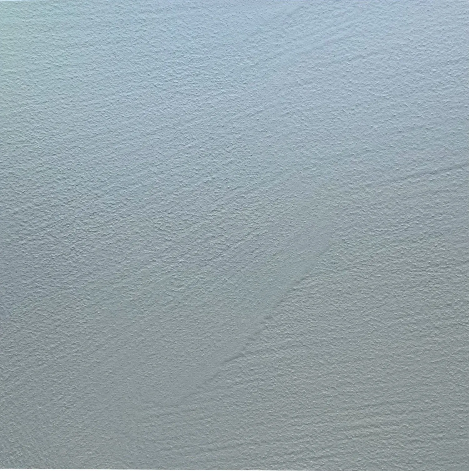 Textured, light blue surface with subtle streaks.