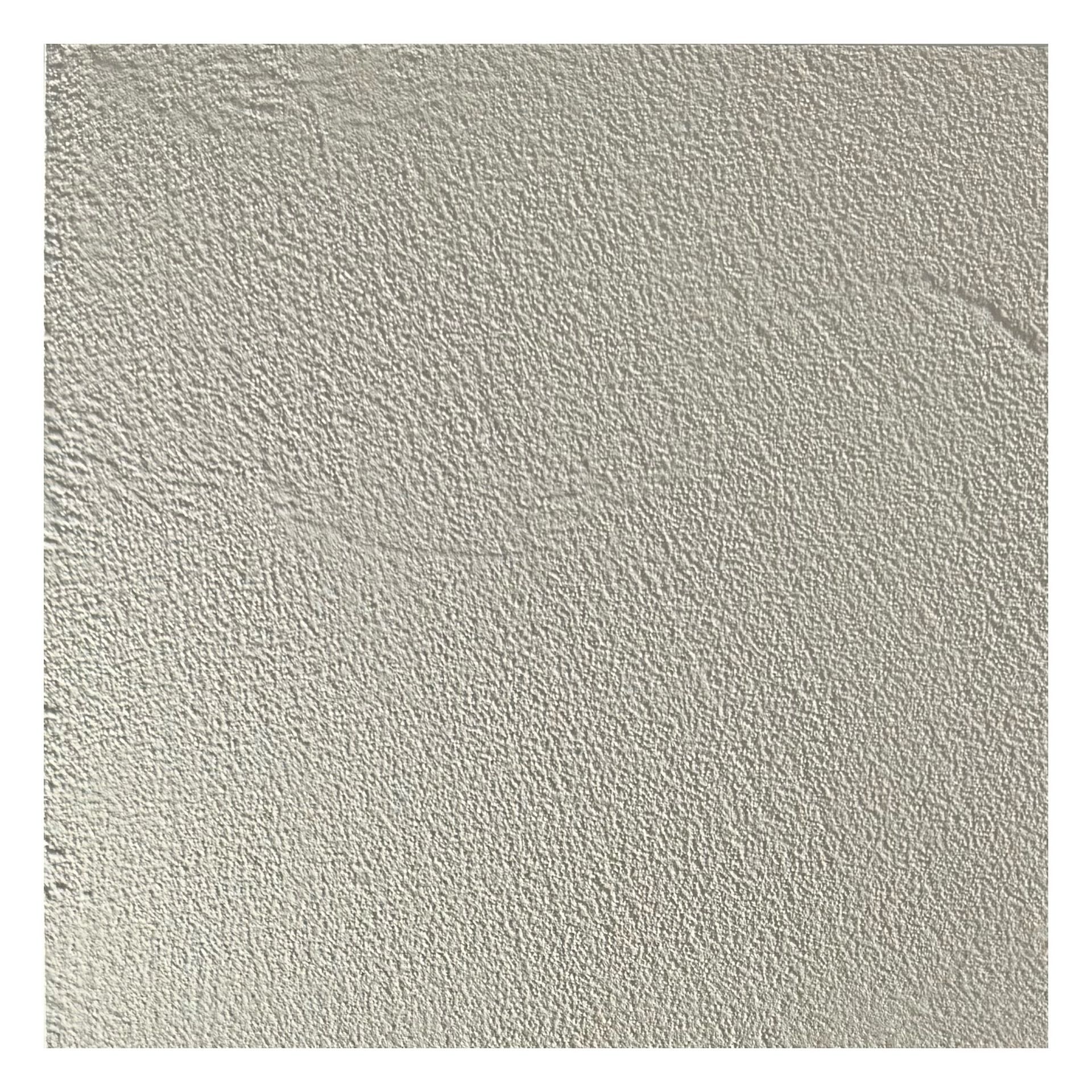 Close-up of a beige textured wall surface with subtle shadows