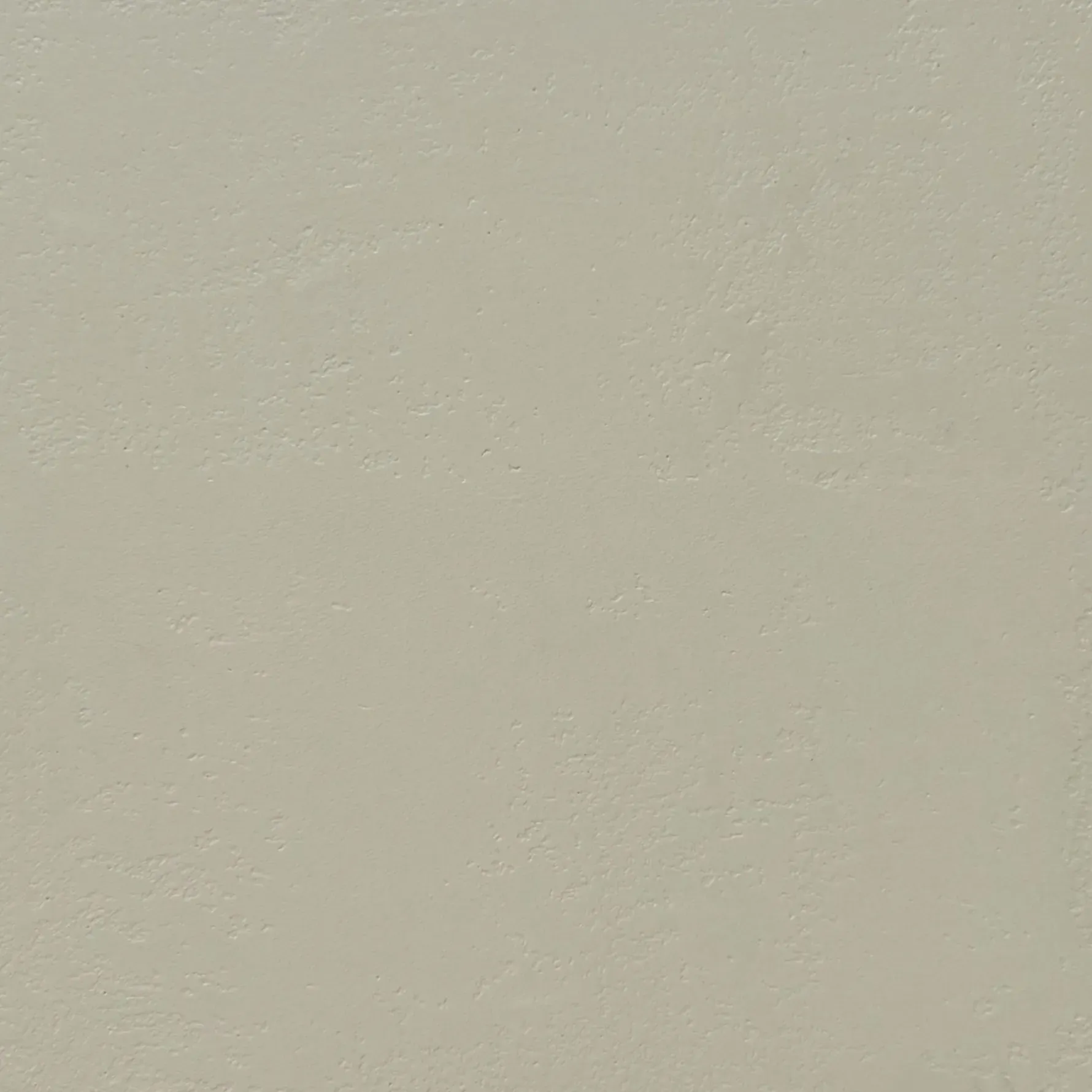 Solid off-white wall texture with a slight mottled appearance.