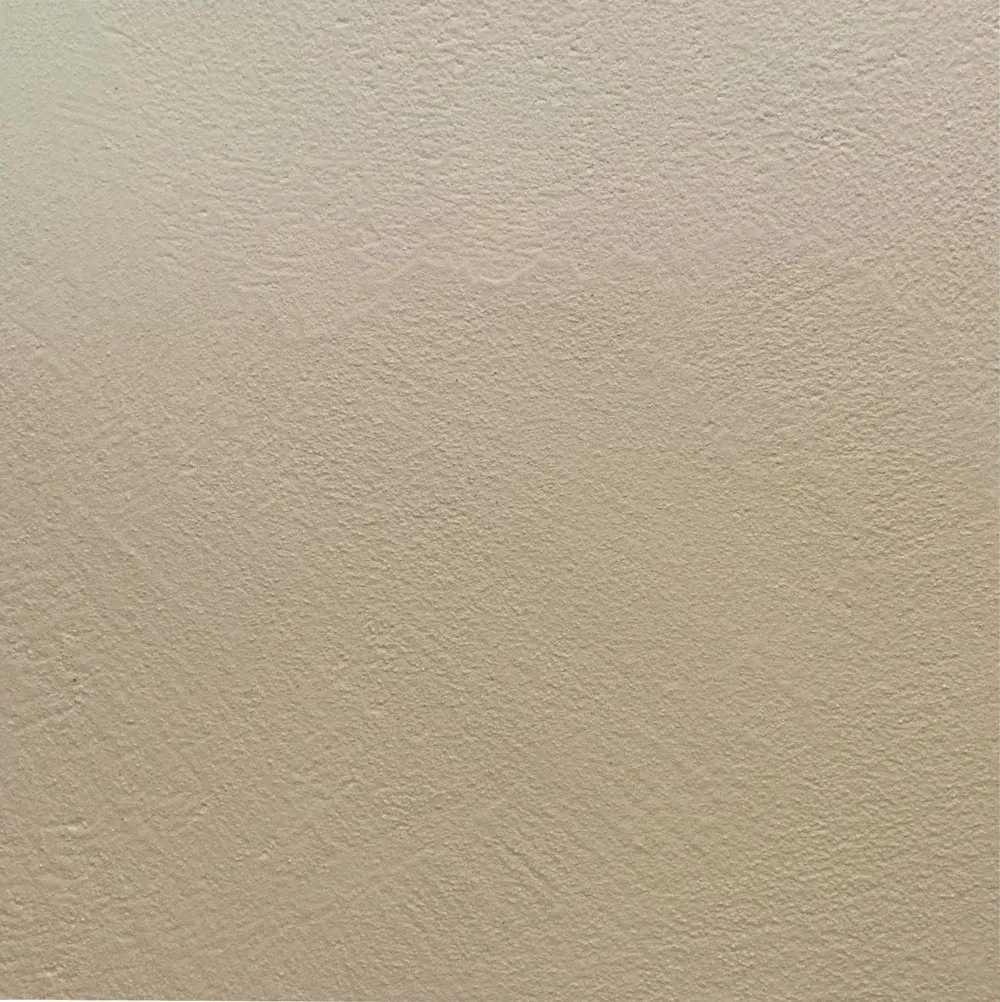 Plain beige textured wall.