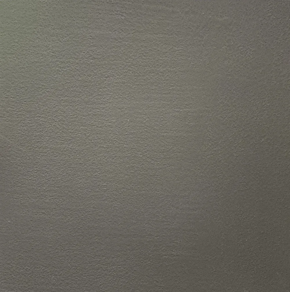 Close-up of a textured gray wall surface with subtle lighting variations