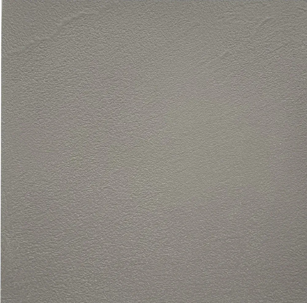 Close-up of a textured light gray wall surface.