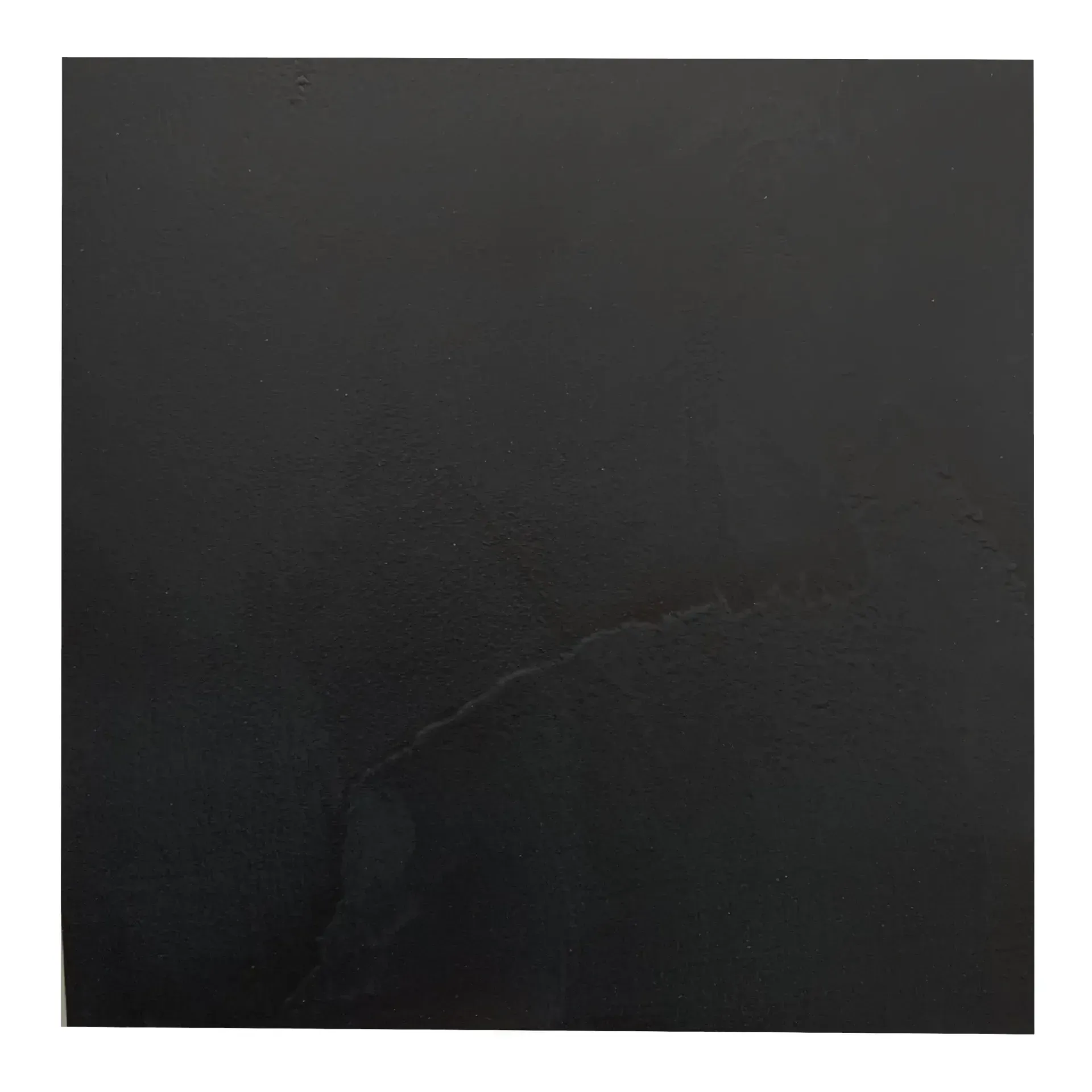 Dark gray surface with a light-colored, branching vein-like pattern.