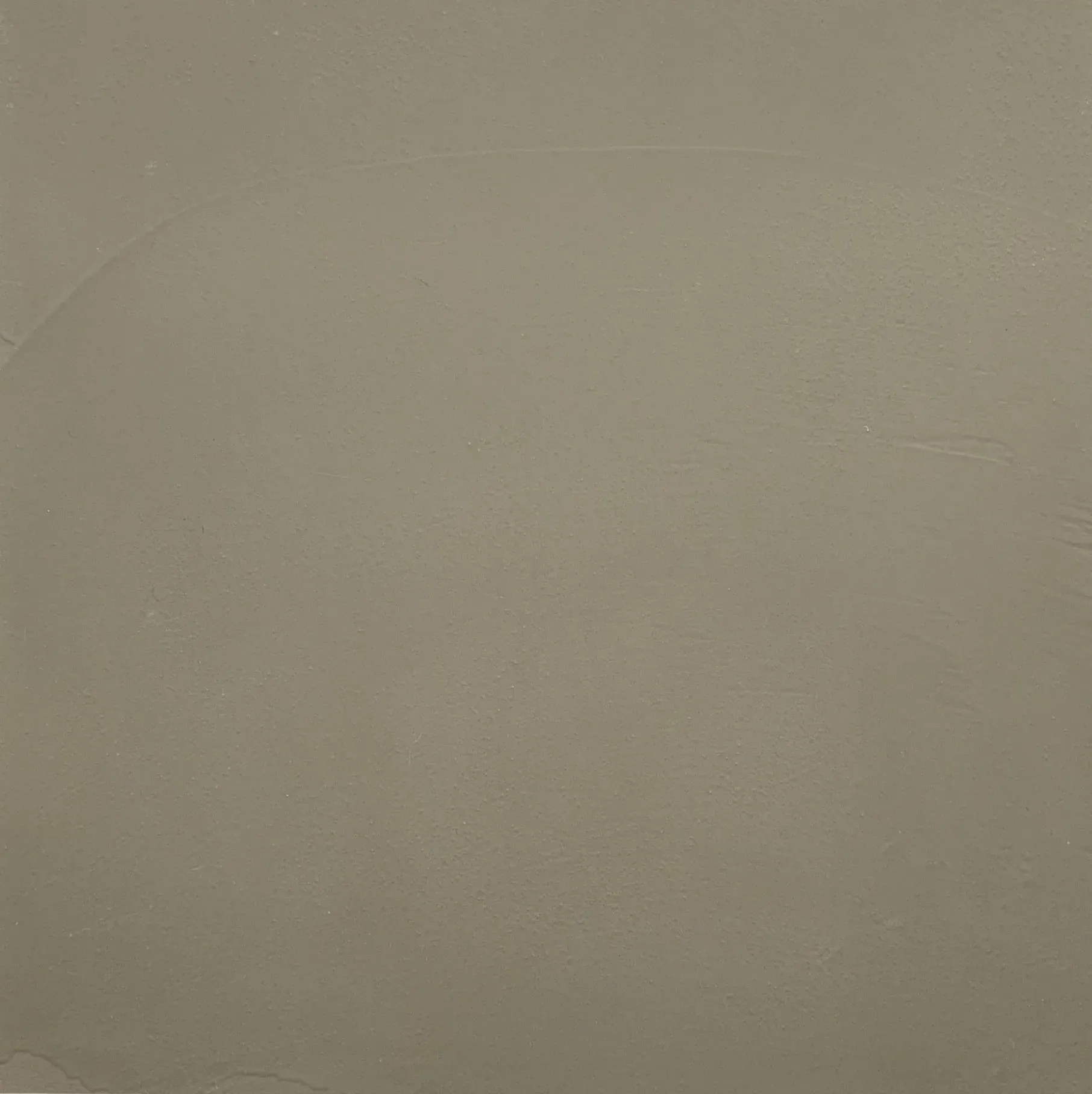 Solid light-brown wall with subtle texture.