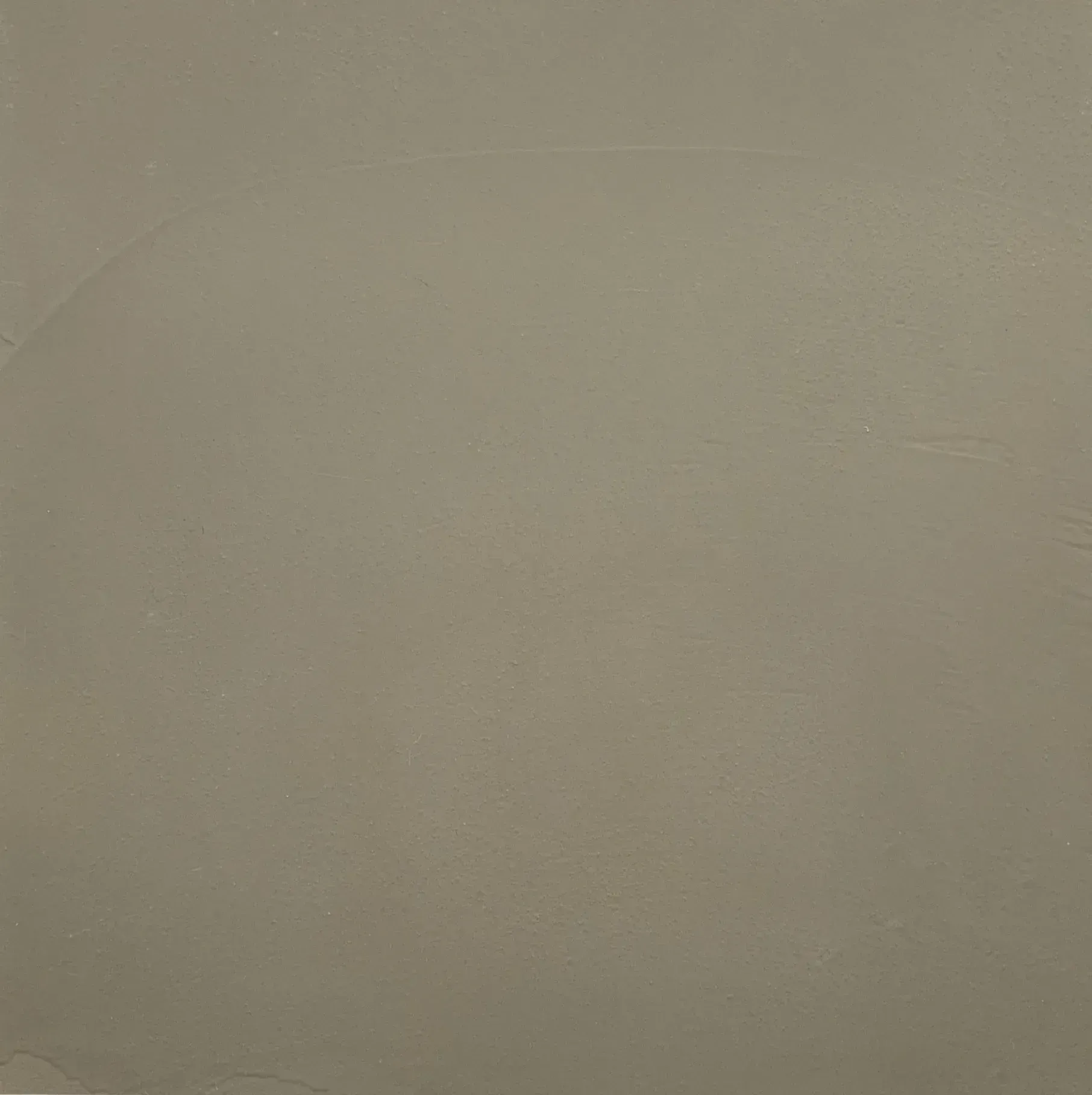 Solid light-brown wall with subtle texture.