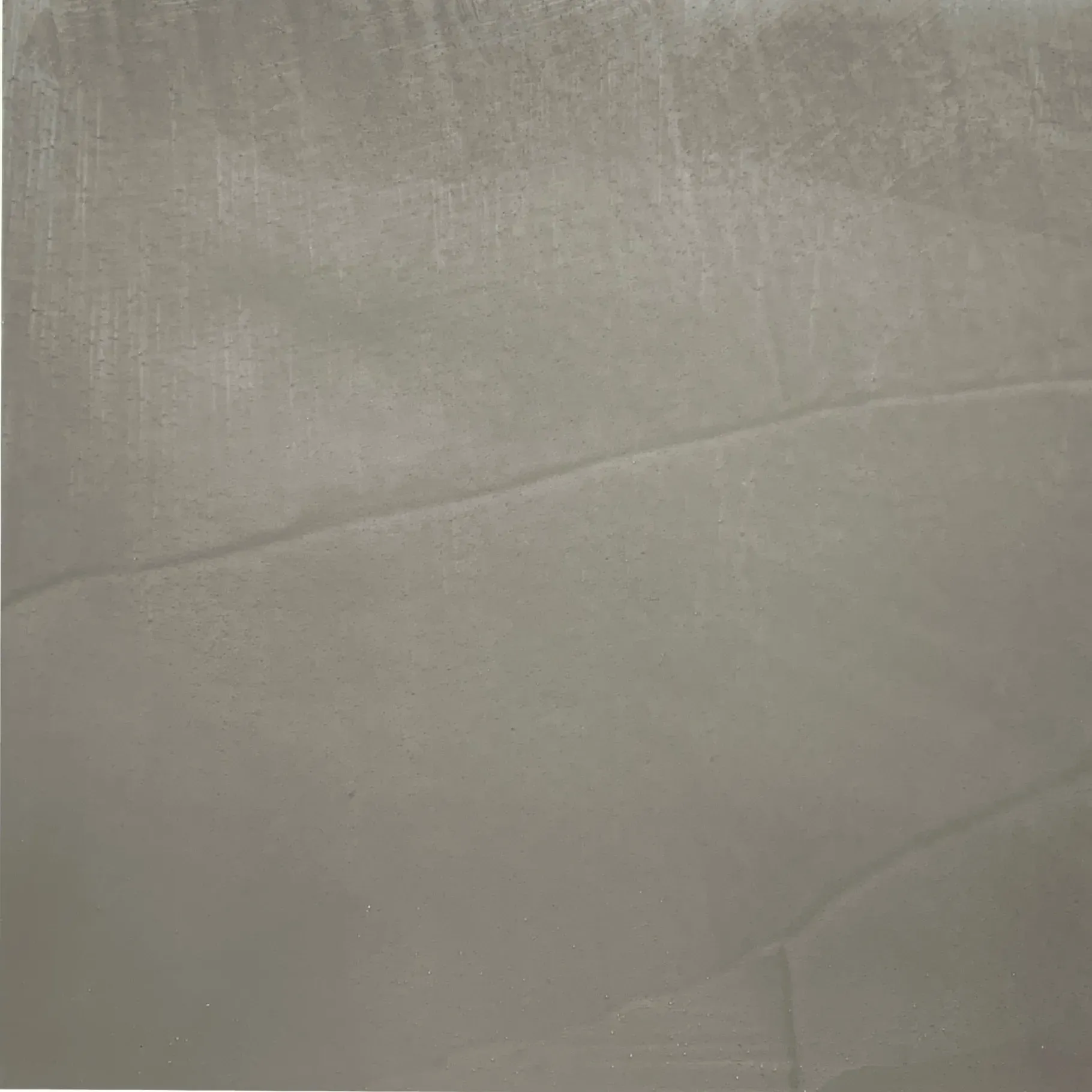 Gray, textured surface with a diagonal lighter-colored streak.