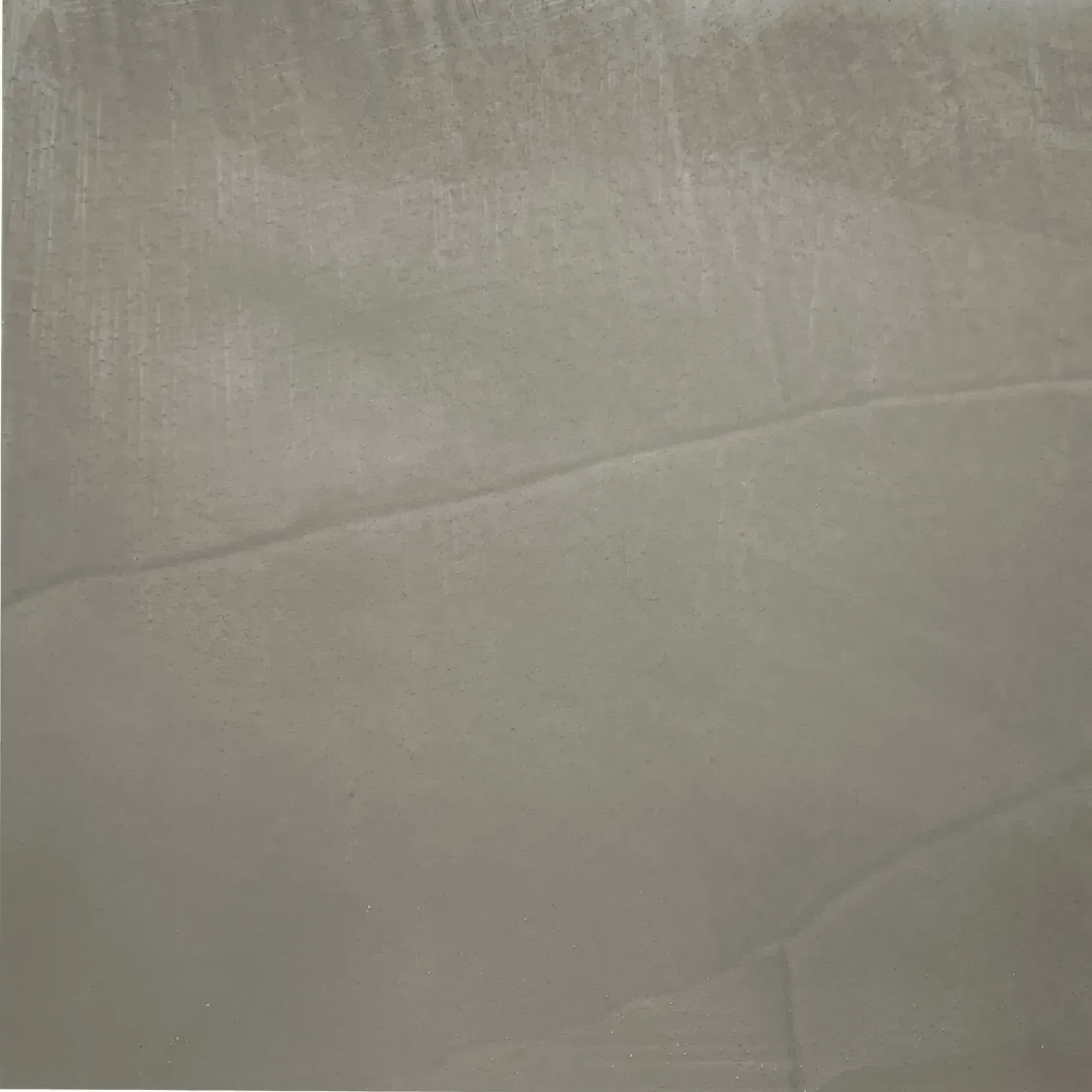 Gray, textured surface with a diagonal lighter-colored streak.