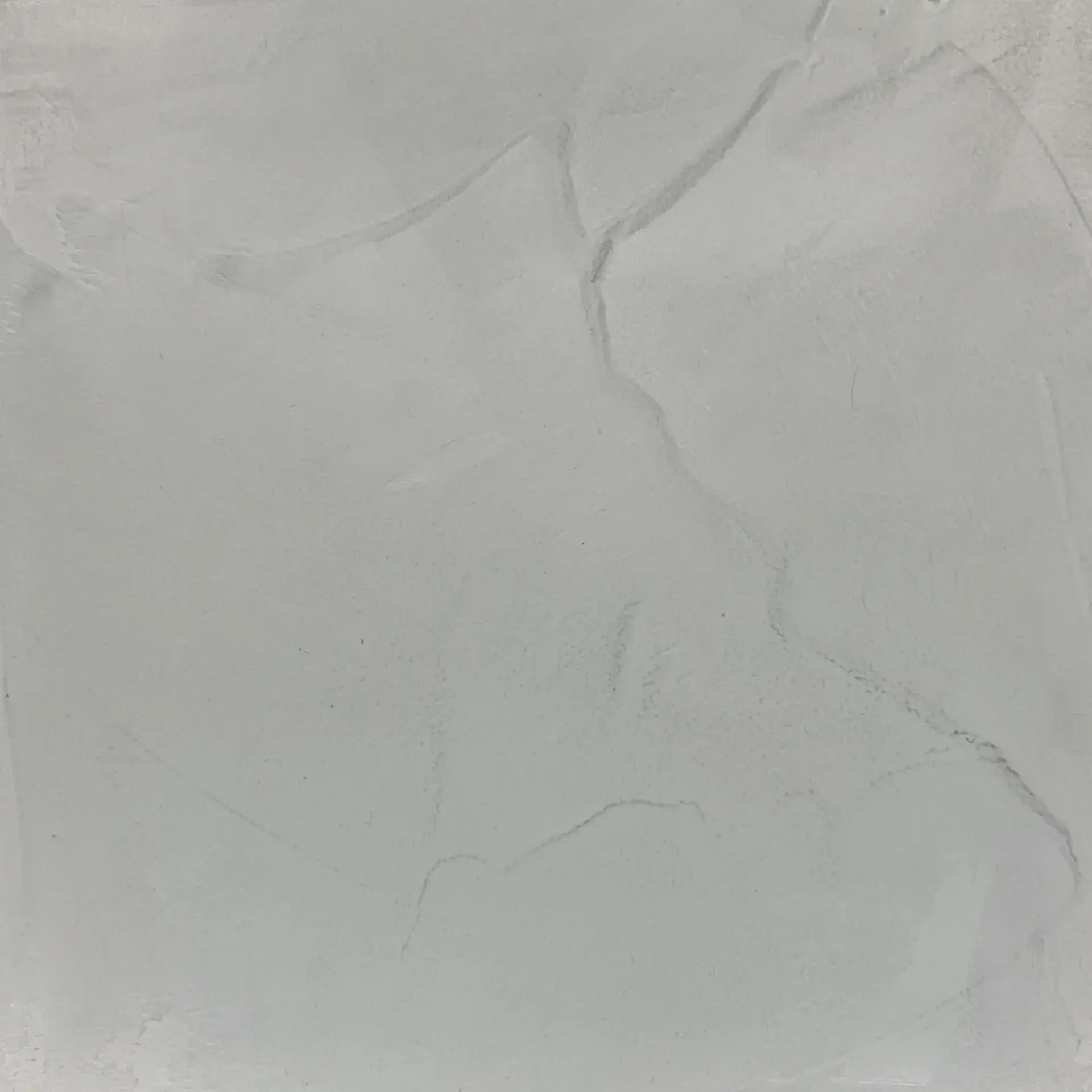 Light gray tile with subtle veining.