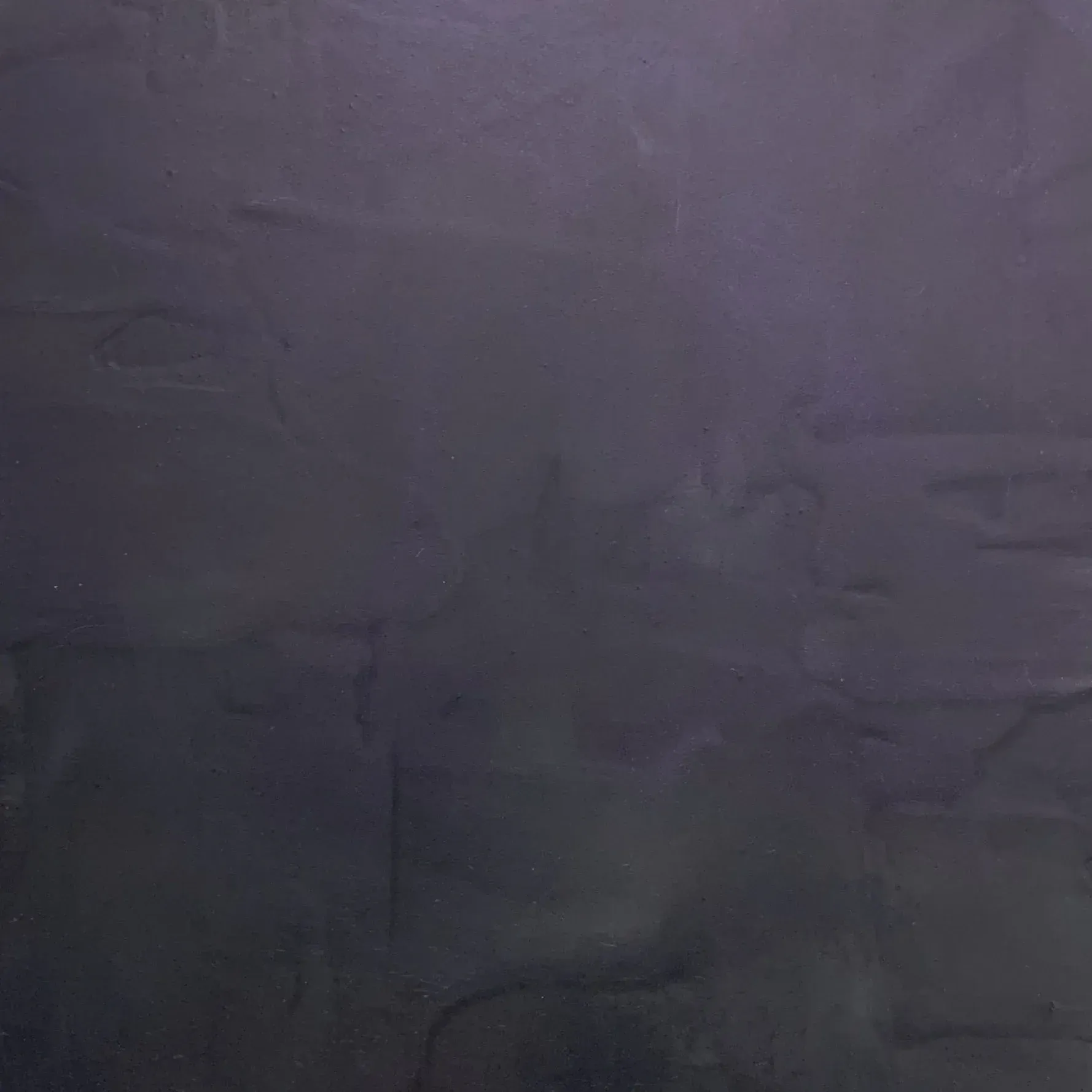 Dark purple mottled background with textured appearance.