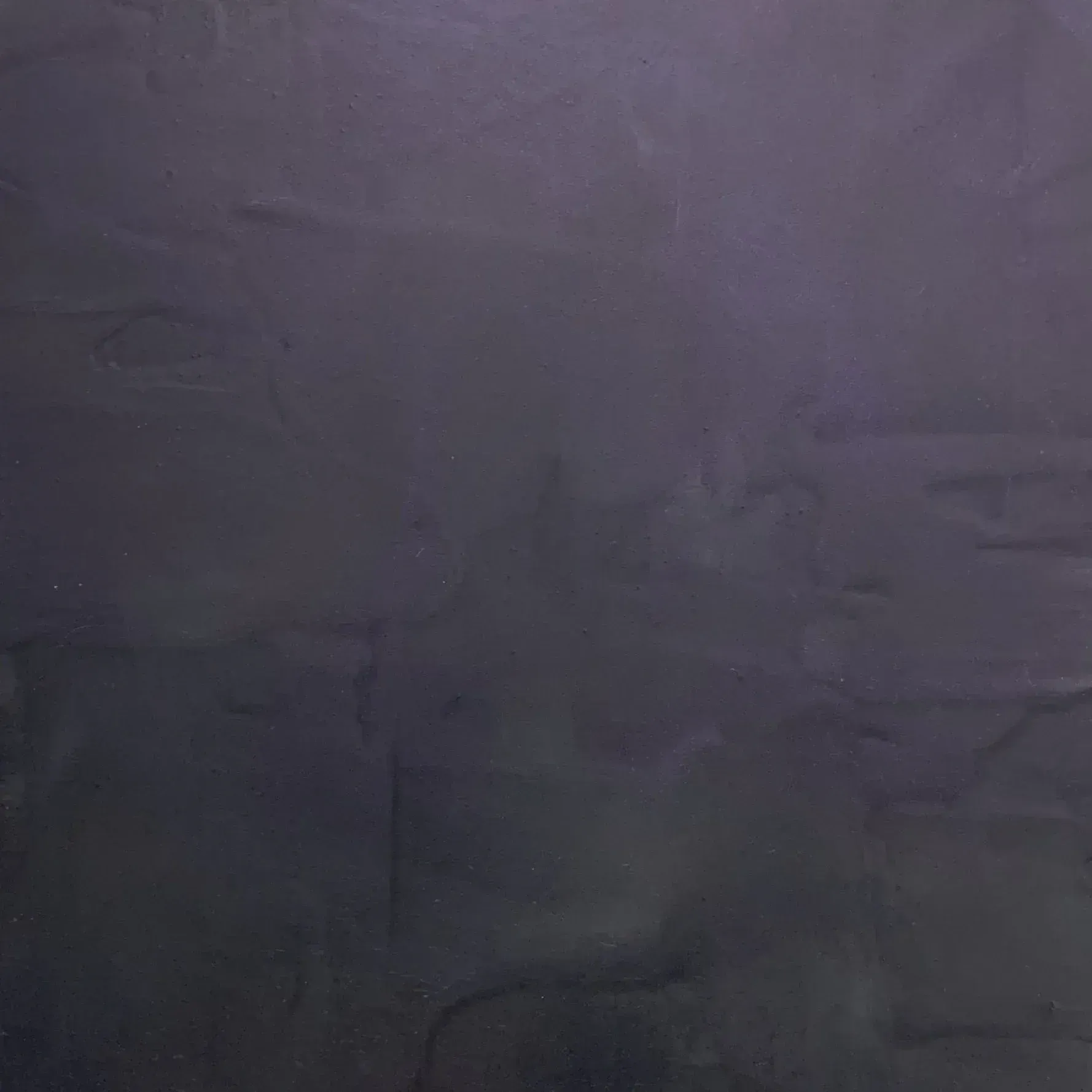 Dark purple textured surface with faint seams and uneven shading