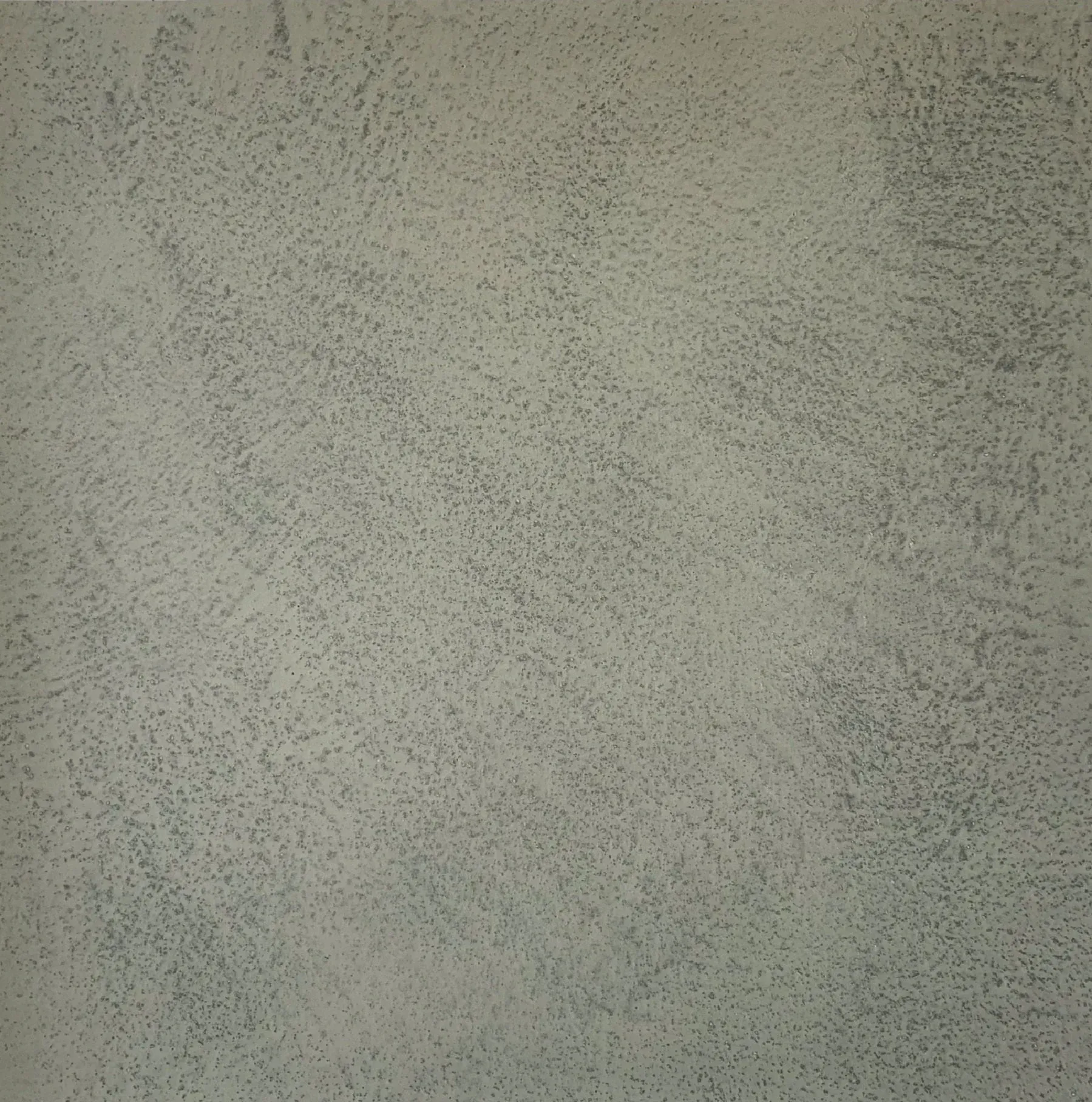 Gray, textured surface with subtle variations in tone, resembling weathered concrete or stucco.
