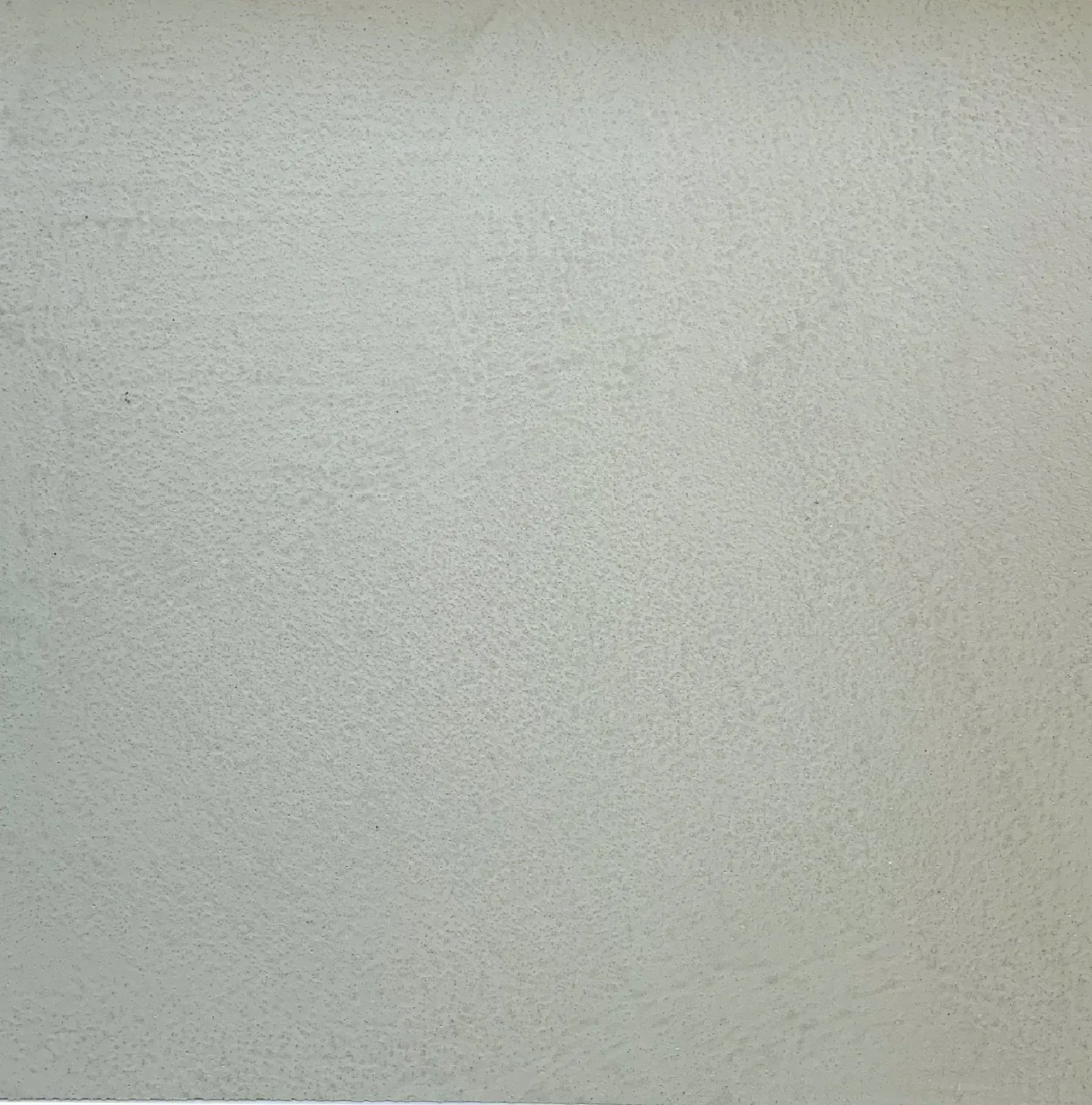 Plain light gray textured wall surface
