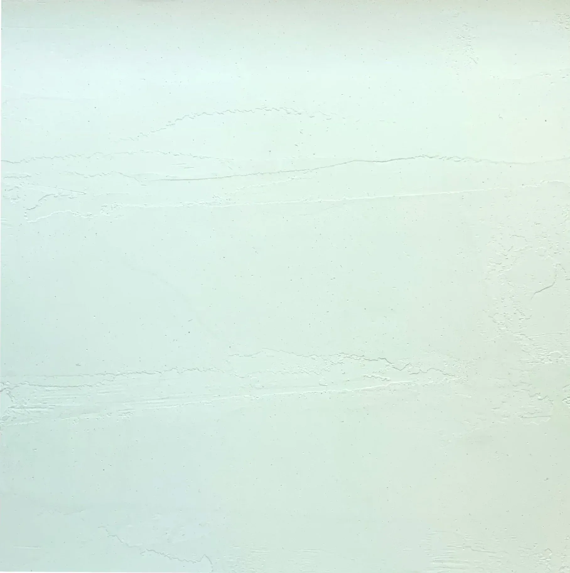 Plain white textured wall with faint horizontal lines and subtle shadows