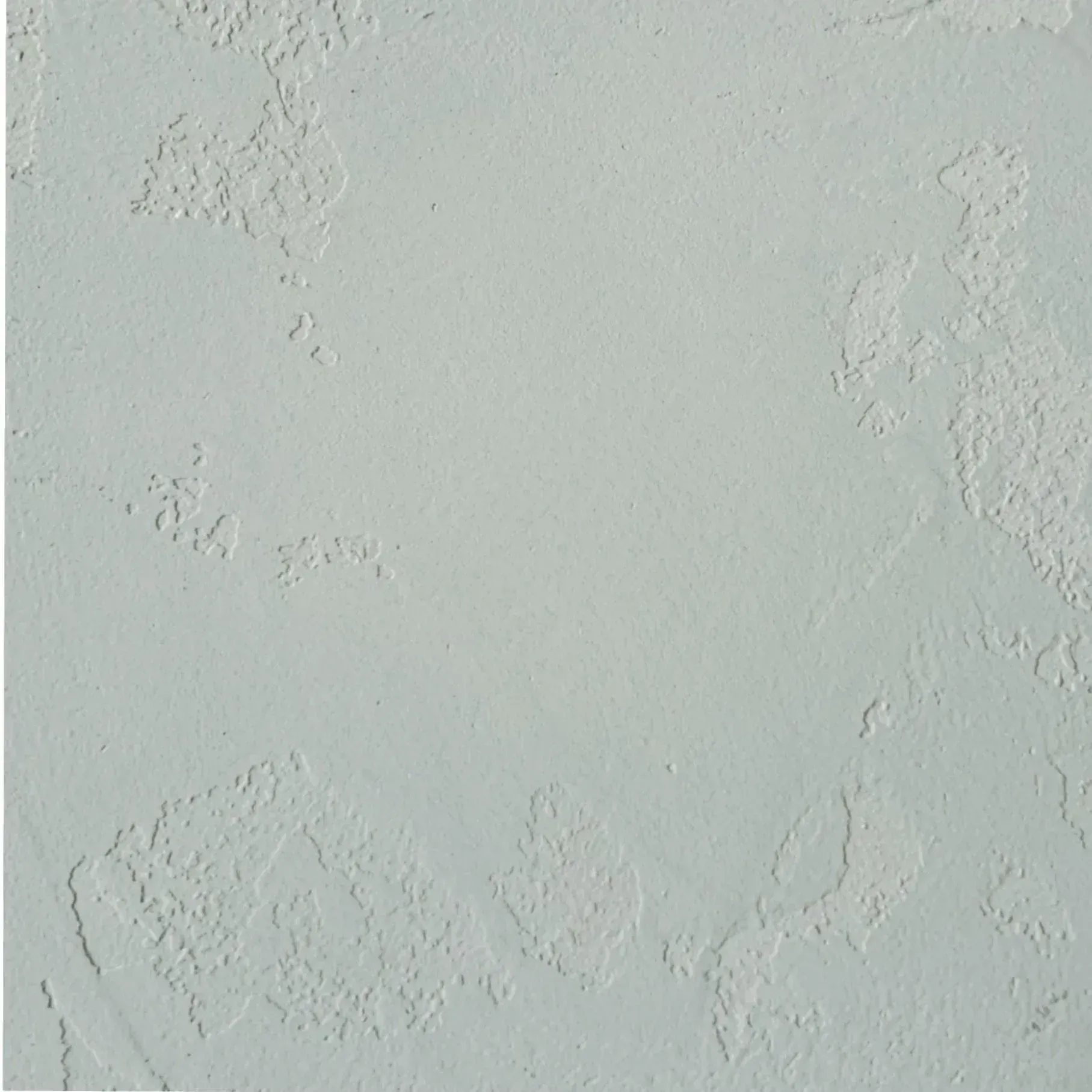 Light gray textured wall with subtle embossed patterns