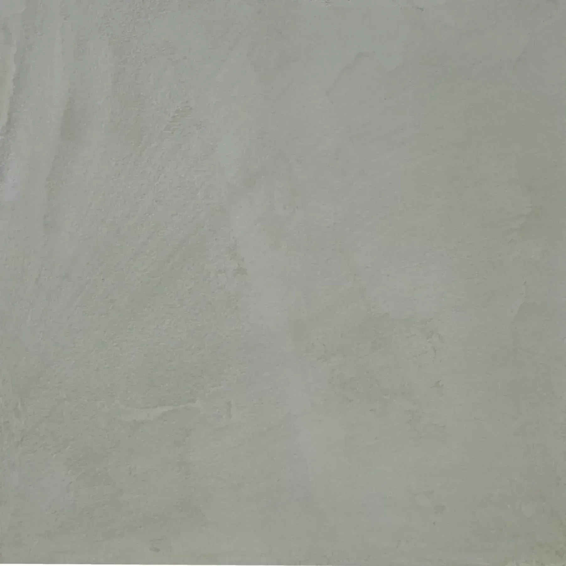 Plain light gray textured wall with subtle brush marks