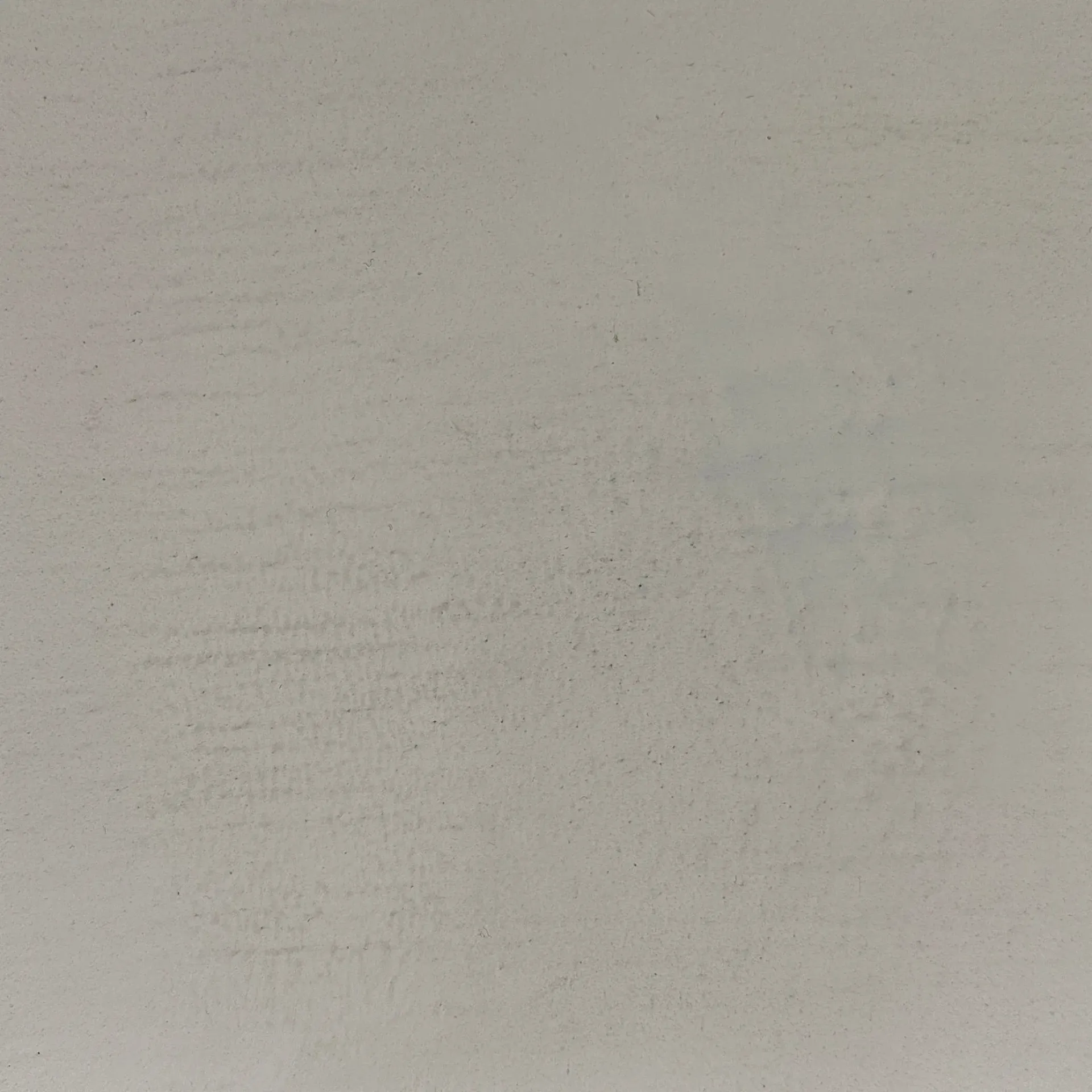 Light gray wall surface with faint texture and minor imperfections.