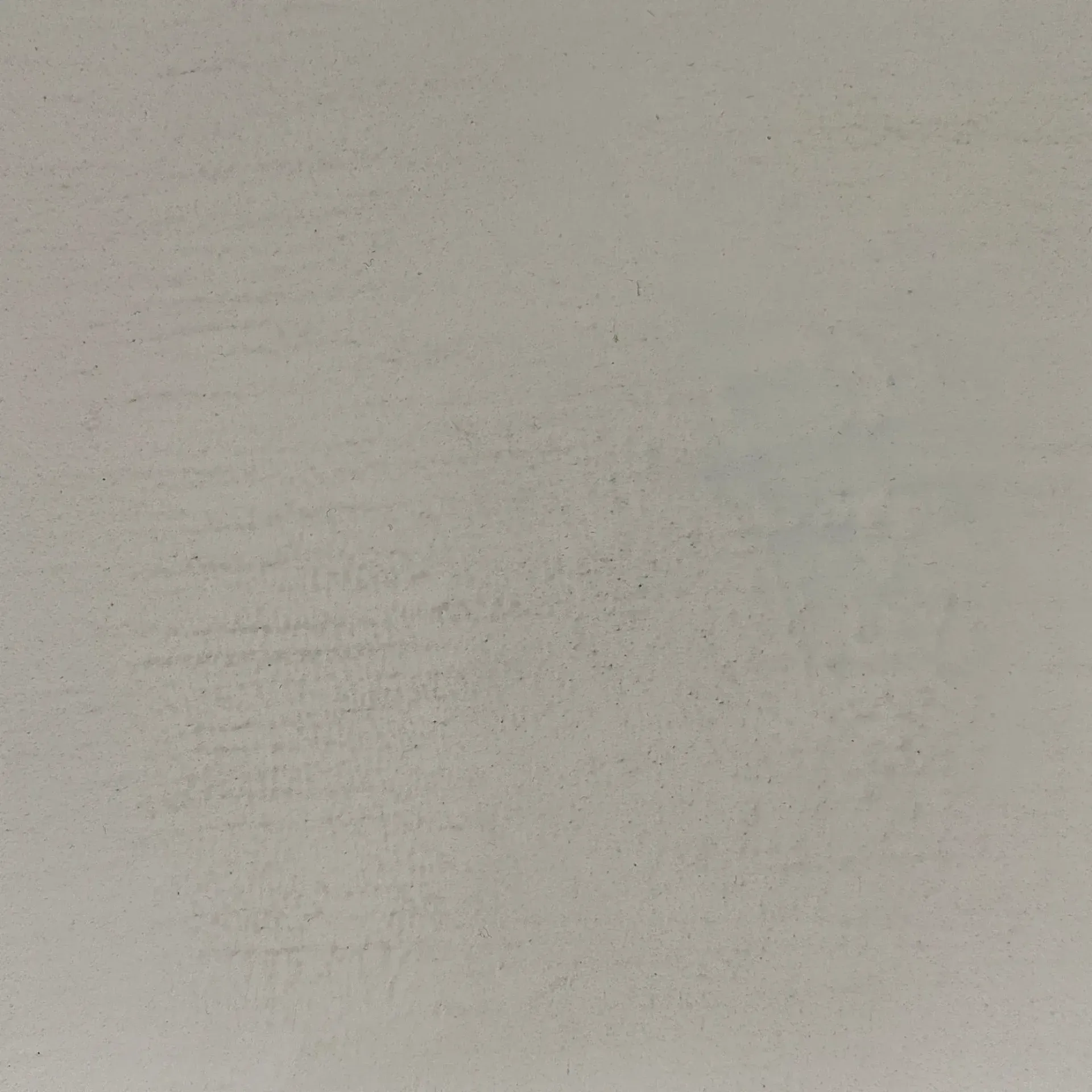 Close-up of a plain light gray textured wall with faint horizontal marks
