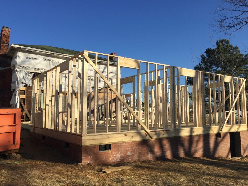 A house is being built with wooden frames.