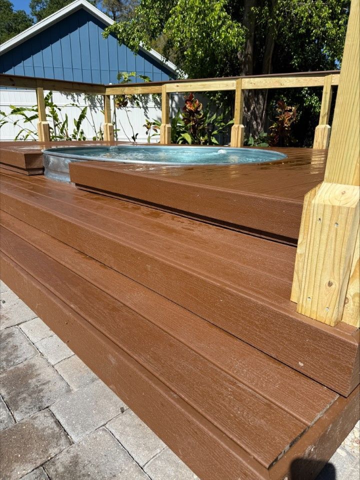 A wooden deck with a hot tub on it
