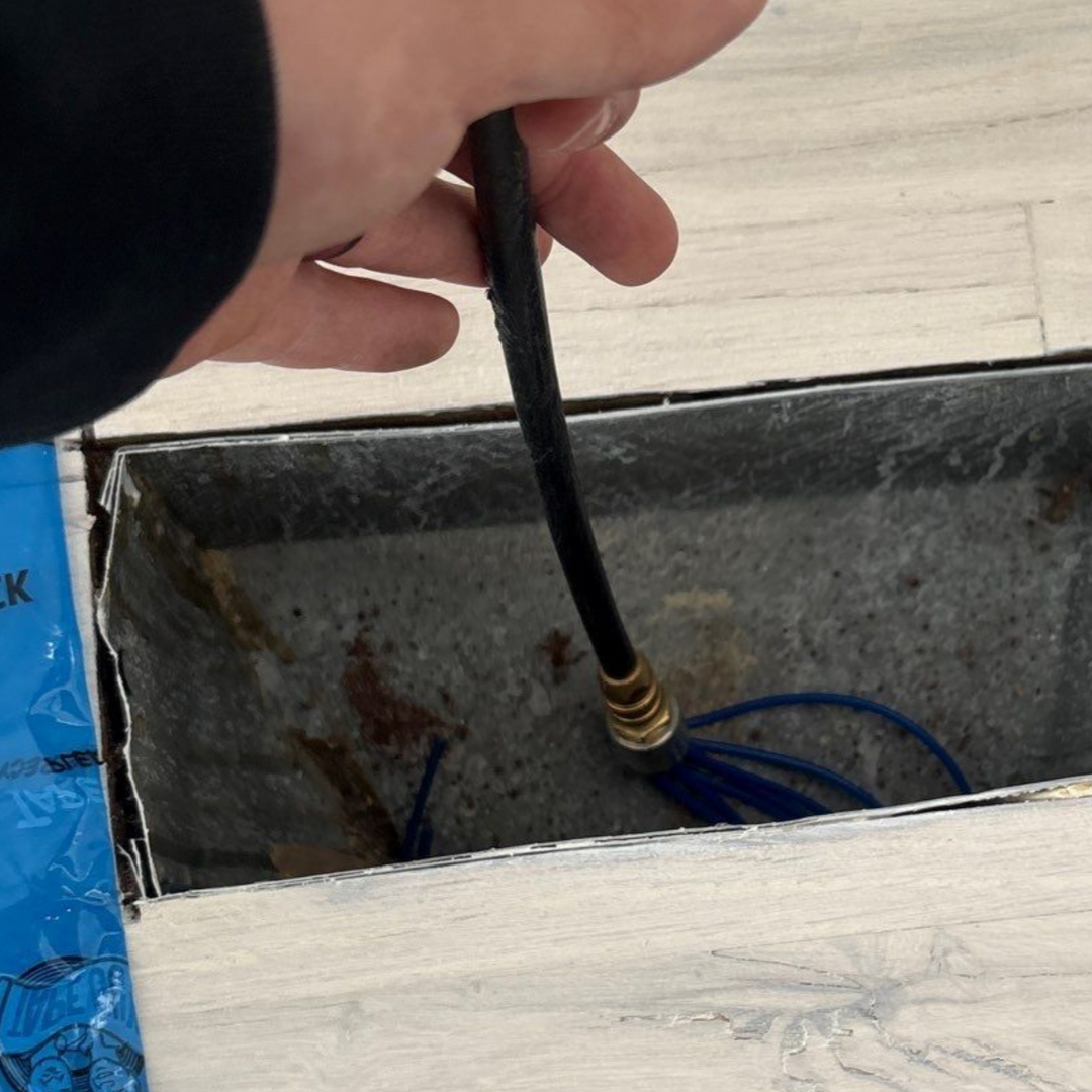 Air duct cleaning the registers on the floor at a home in Westhampton Beach NY