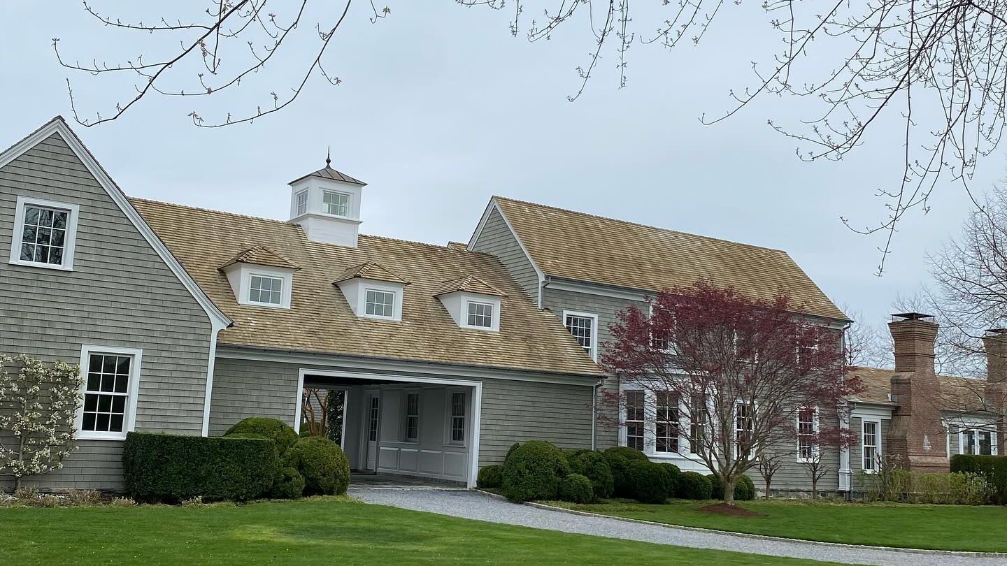 Results of an expert cedar shake roof soft washing by K.O.S. cleaning on Long Island. 
