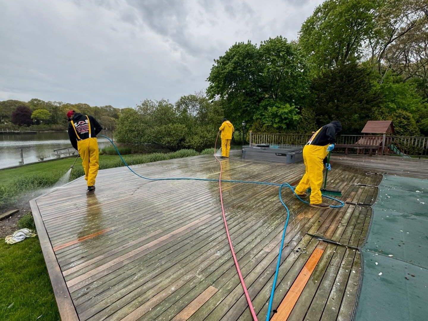 KOS is pressure washing a pool deck on Long Island