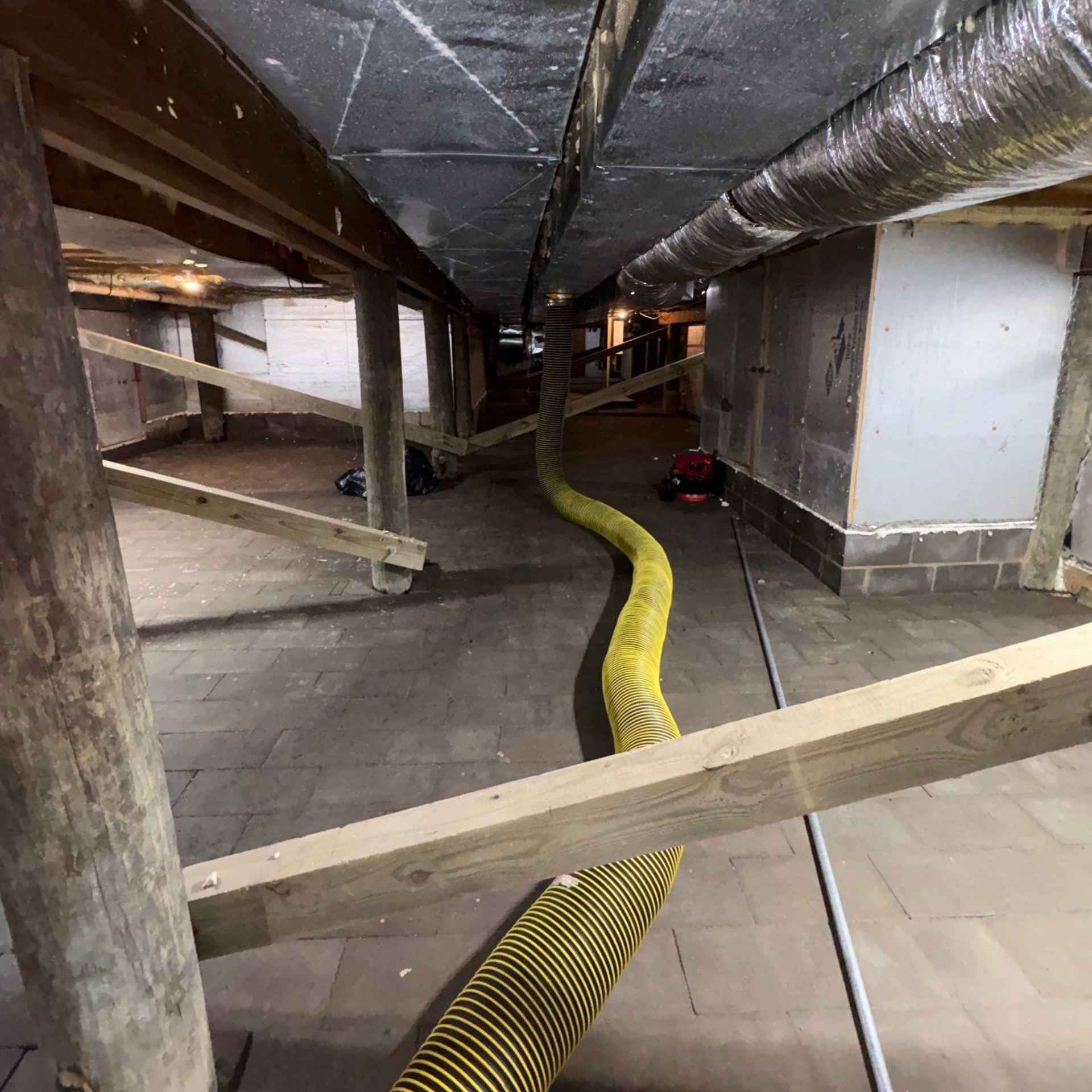 HEPA rated truck mounted air duct cleaning machine connected to the HVAC system at a home in Westhampton Beach NY