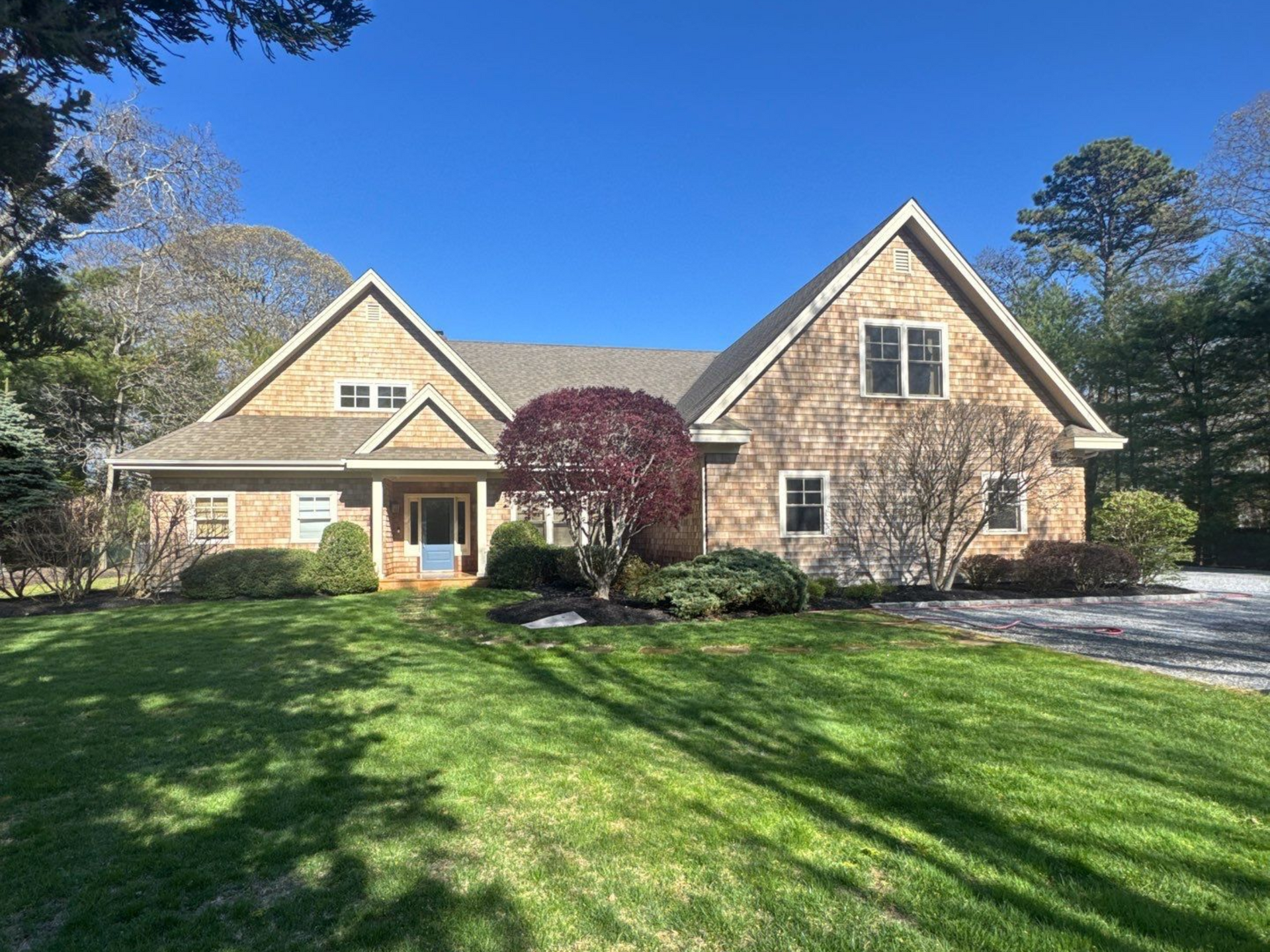 Cedar siding cleaned with soft washing at a home in Westhampton NY