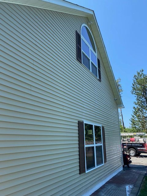 After cleaning and treating siding for algae.