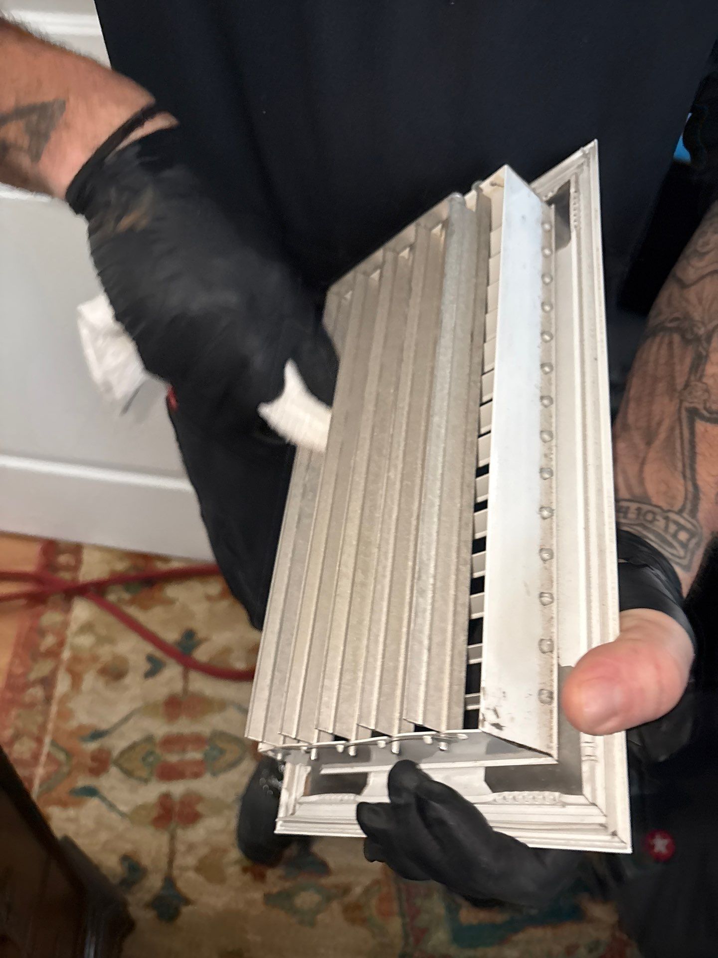 Cleaning vent covers at a home in East Patchogue NY