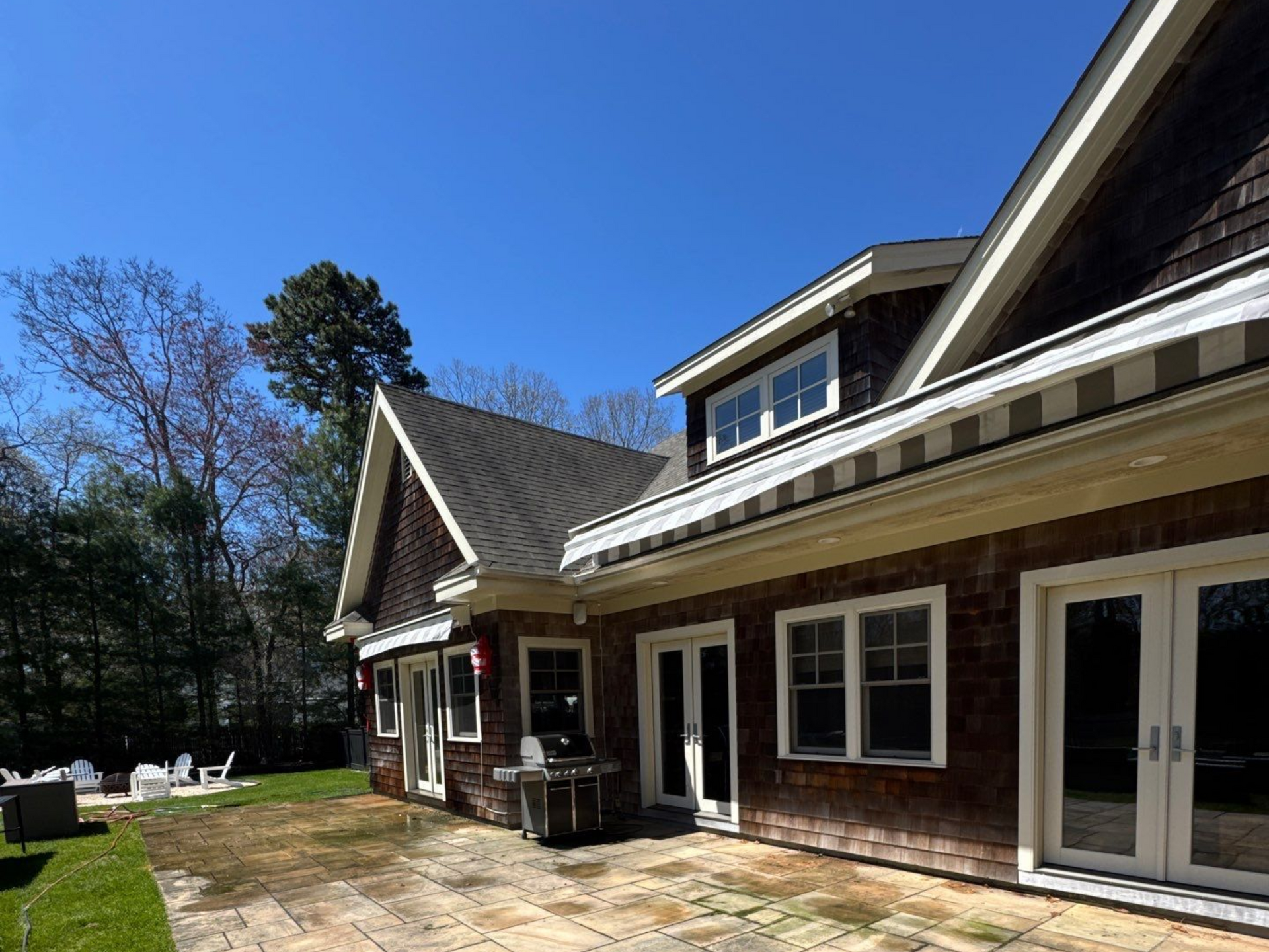 Back of house in Westhampton before soft washing of cedar shake siding