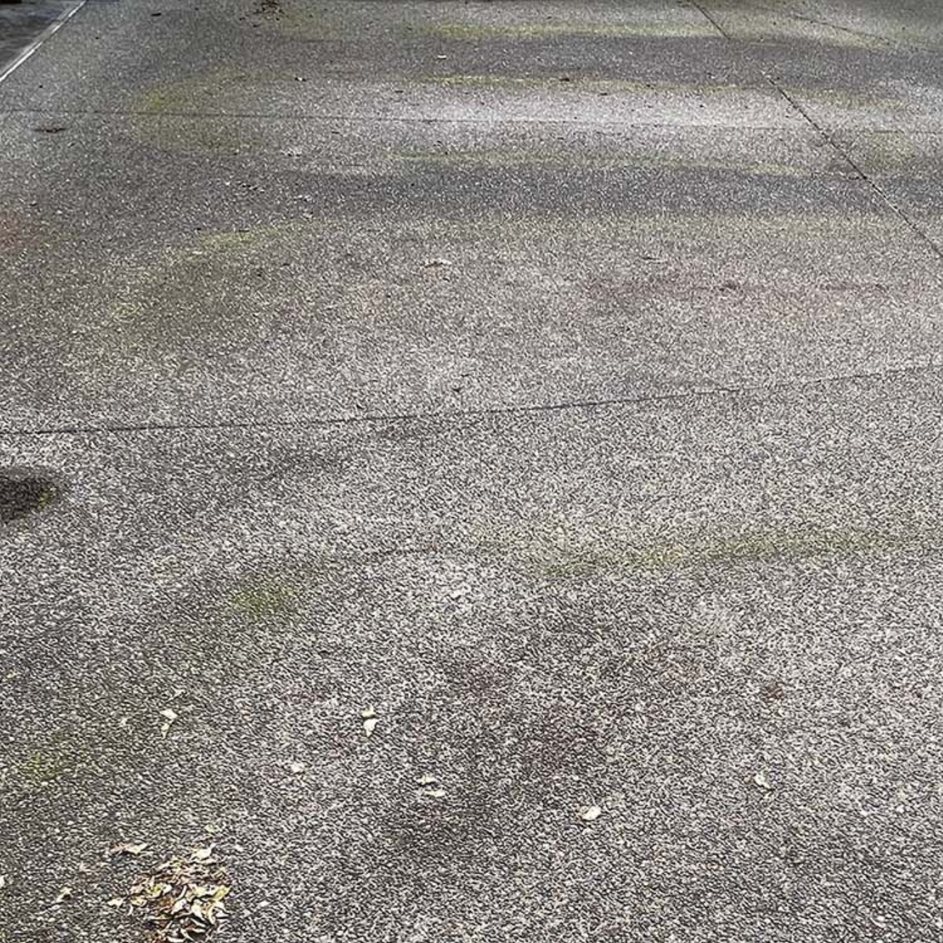 Concrete driveway with visible staining in Suffolk county NY