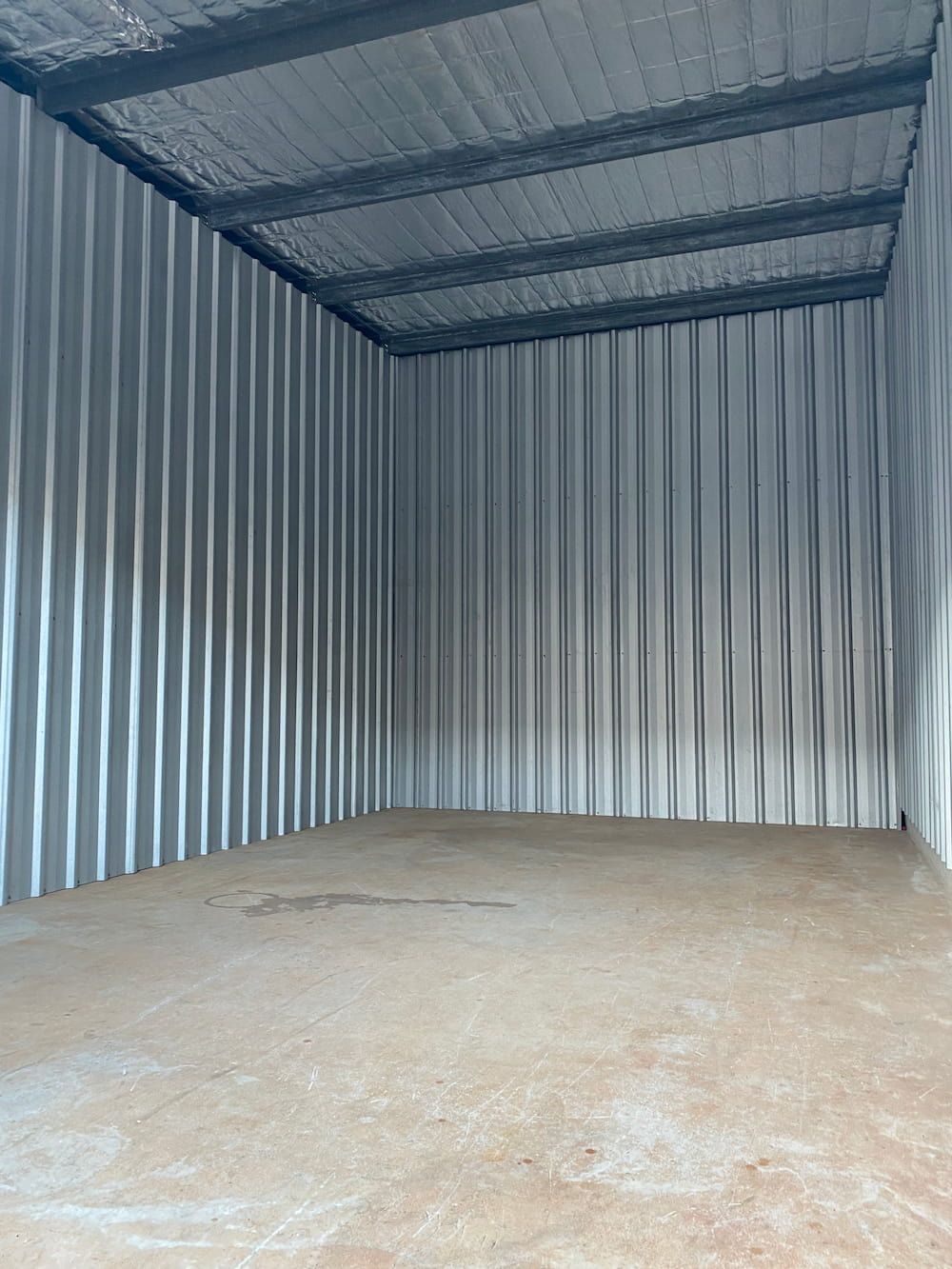 A Large Empty Room With A Metal Roof And Walls — Acacia Mini Storage in Port Macquarie, NSW