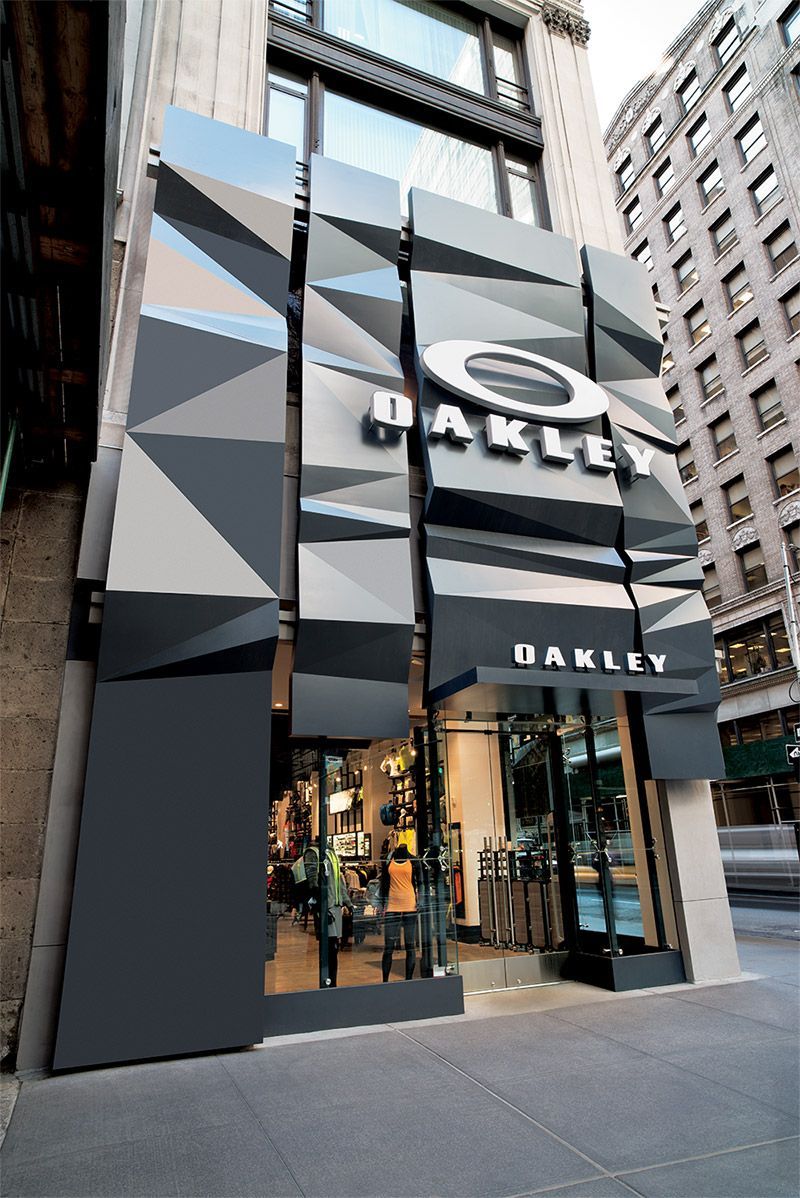 Oakley storefront with black-and-gray geometric facade on a city street