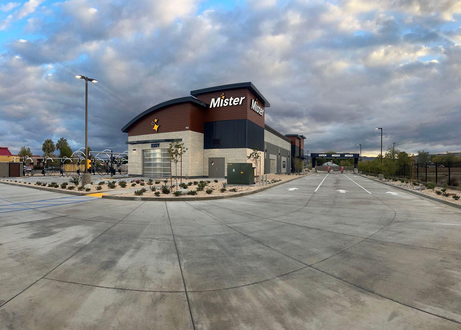 Exterior of a Maverik convenience store under a cloudy sky, with an empty parking lot