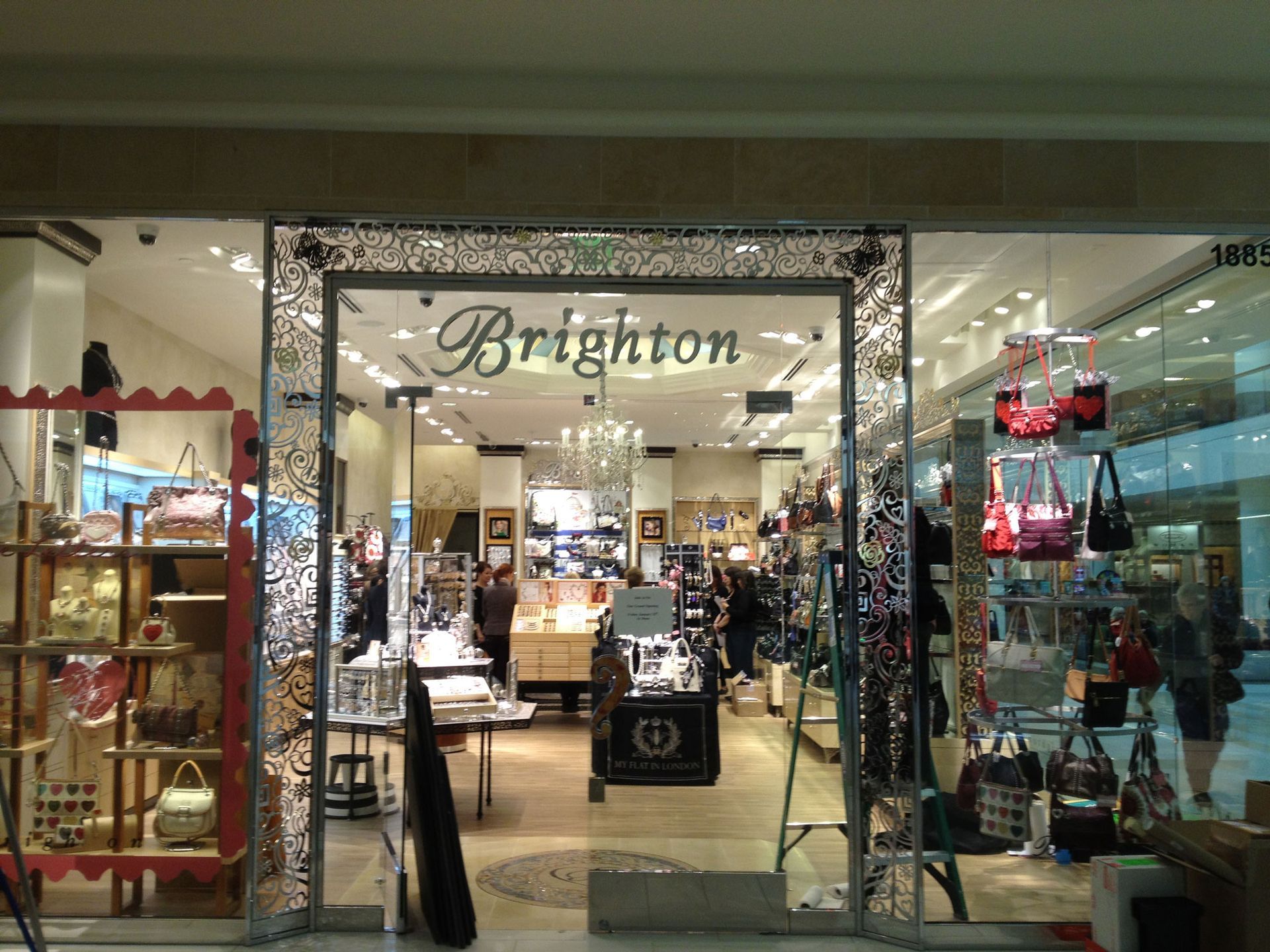 Storefront of Brighton boutique with glass entrance and displays inside shopping mall
