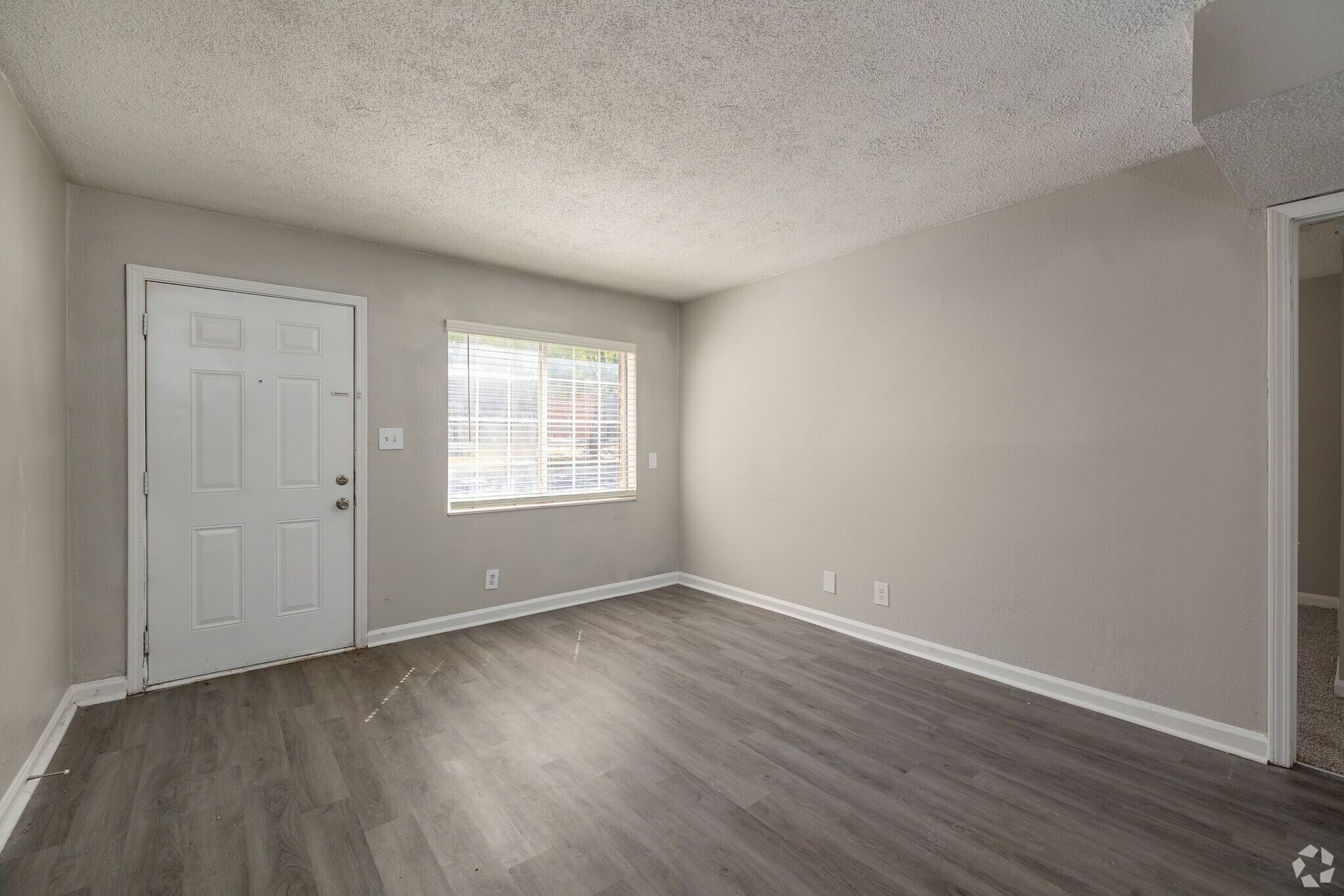 Photo of the living room, seen from the view of the kitchen