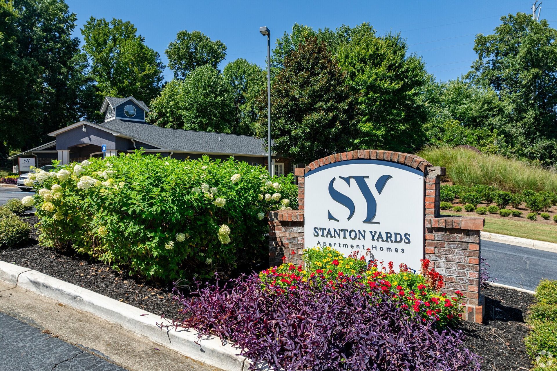Photo of the entrance to the community with a sign that reads Stanton Yards Apartment Homes