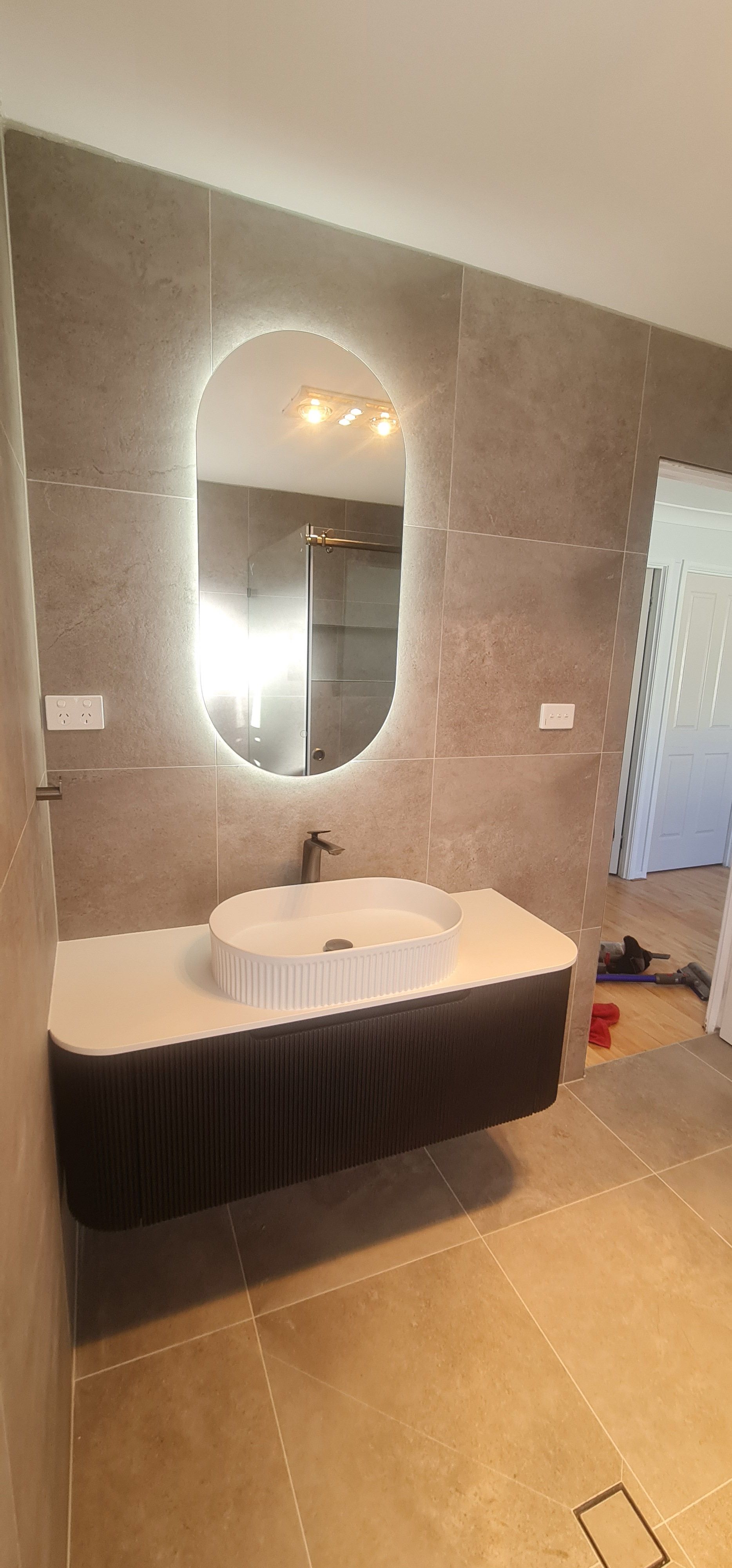 Bathroom renovation — vanity and mirror detail