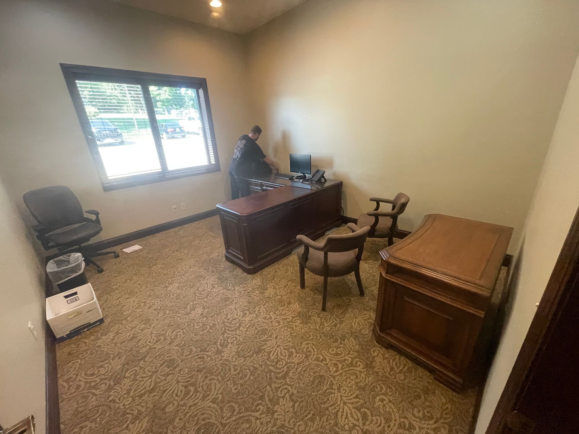 Trio of Heartz crew handling residential furniture on move day in Saint Joseph, Missouri