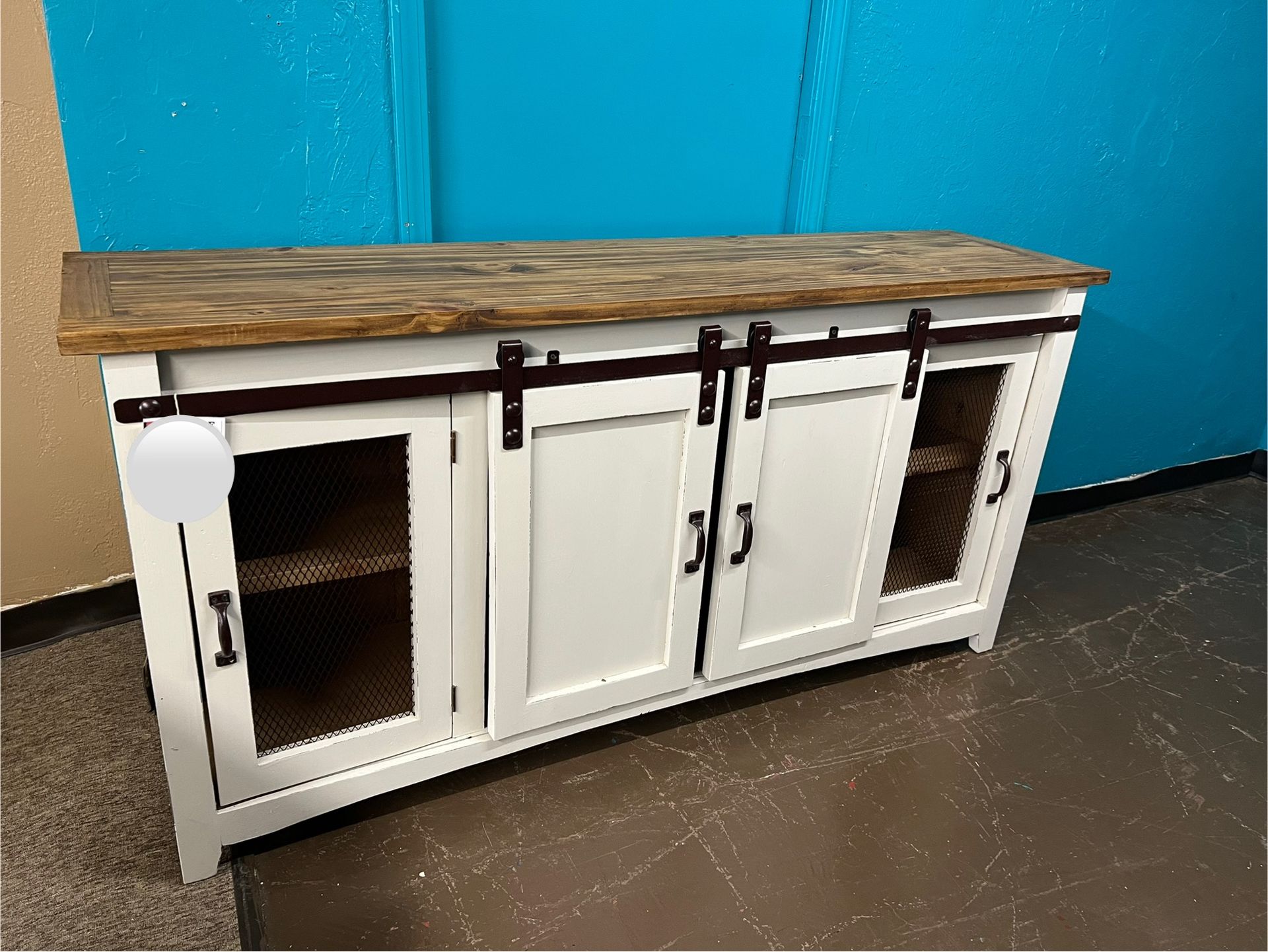 Wooden cabinet with sliding doors, mesh inserts, brown color, rustic style.