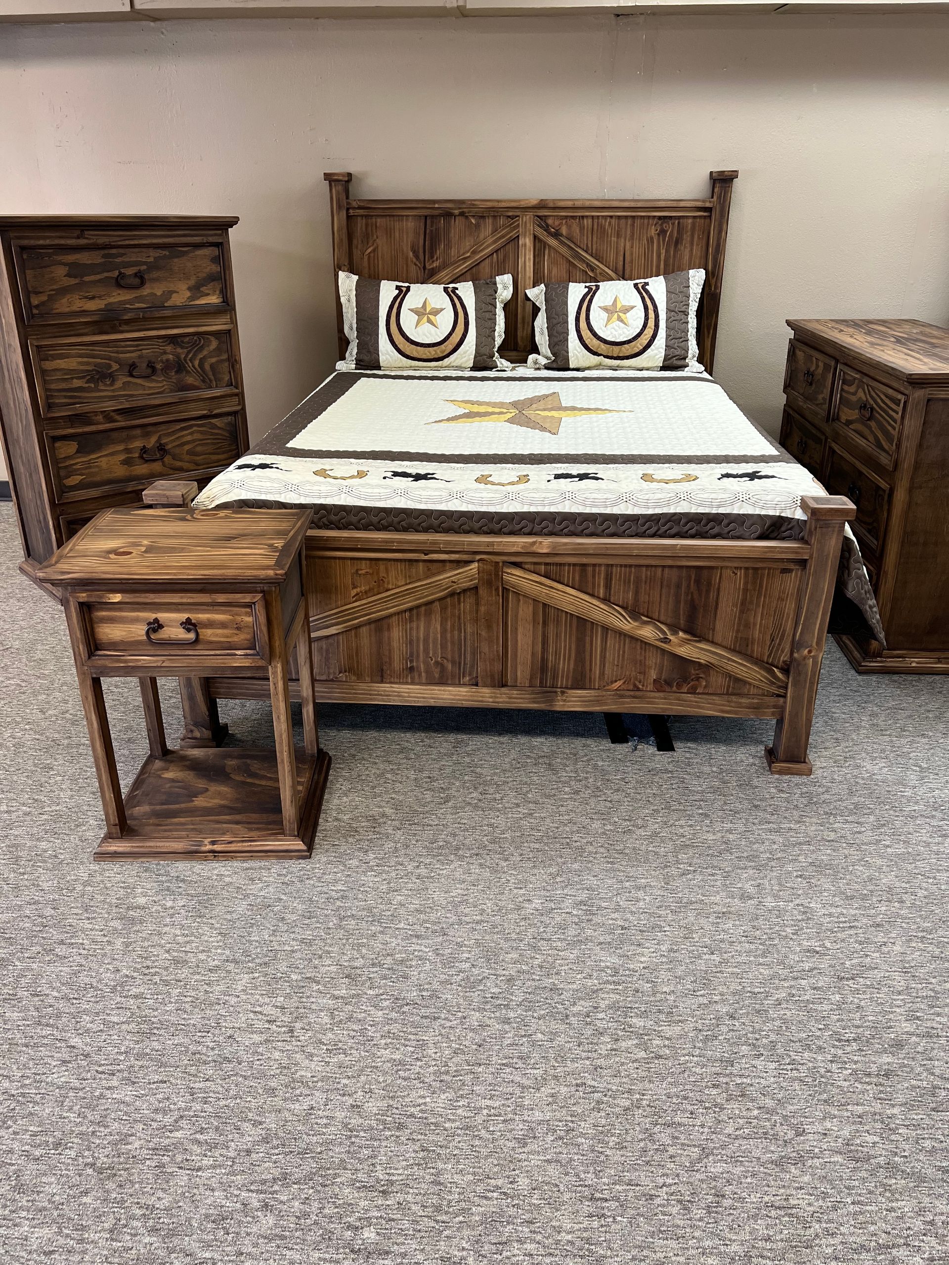 Wooden bedroom set: bed, nightstand, dresser, and chest. The furniture has a rustic, dark brown finish.