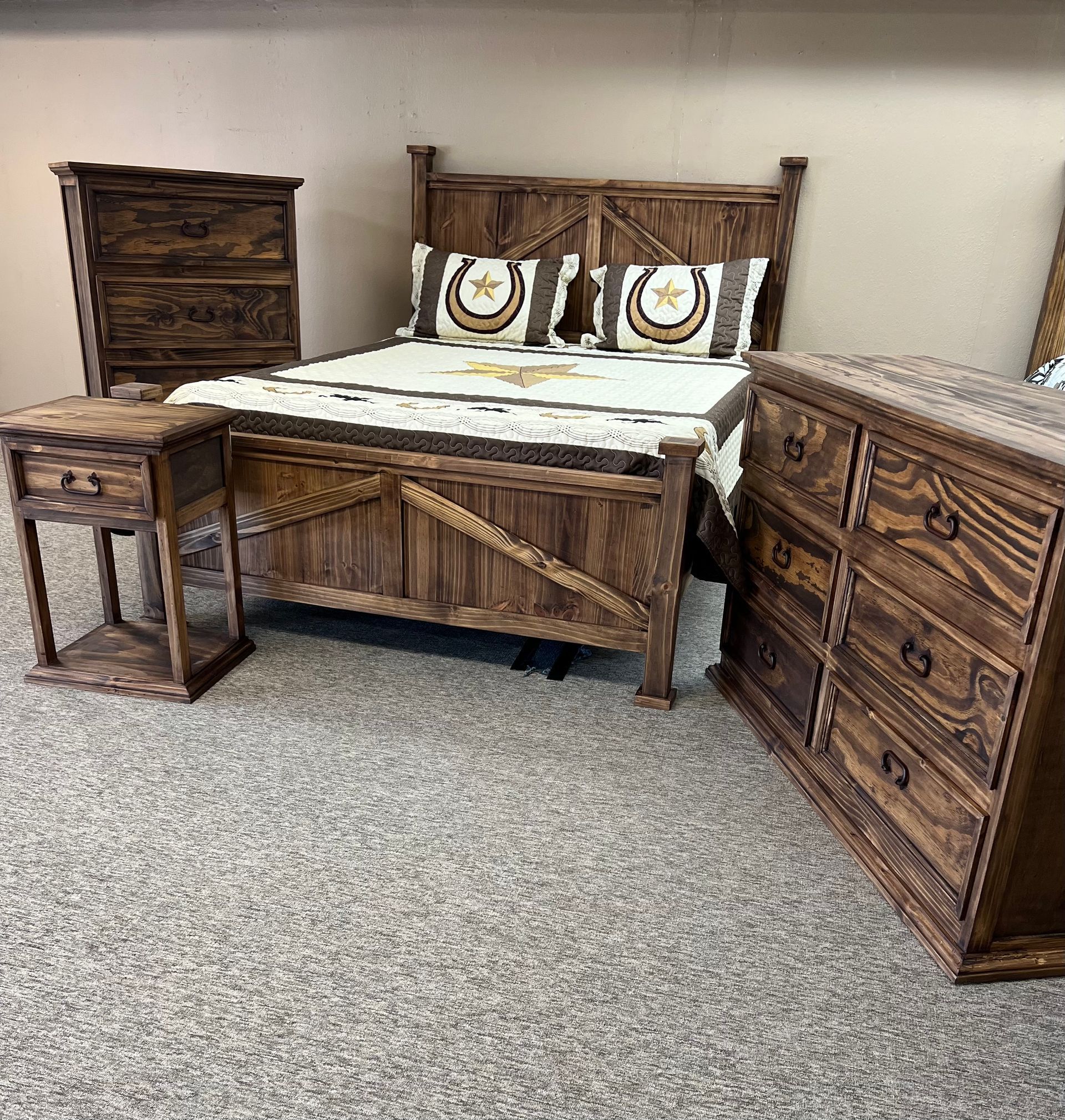 Wooden bedroom set: bed, nightstand, dresser, and chest. The furniture has a rustic, dark brown finish.